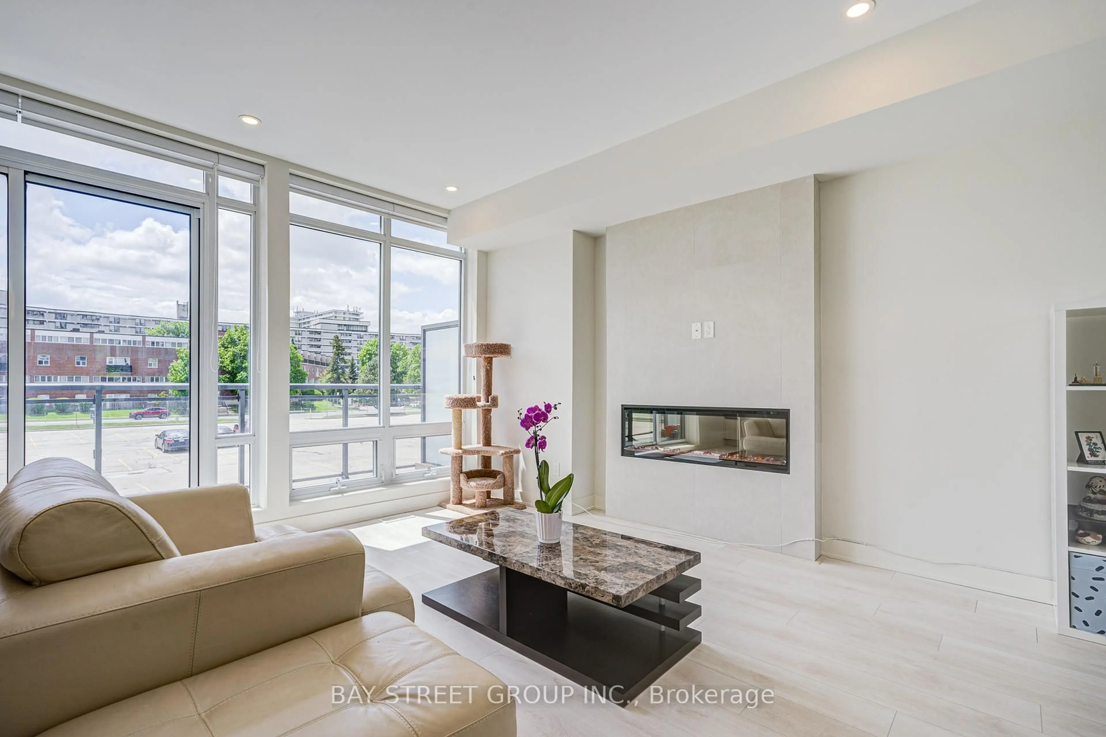 Living room with furniture, ceramic/tile floor for 27 Sonic Way, Toronto Ontario M3C 0P3