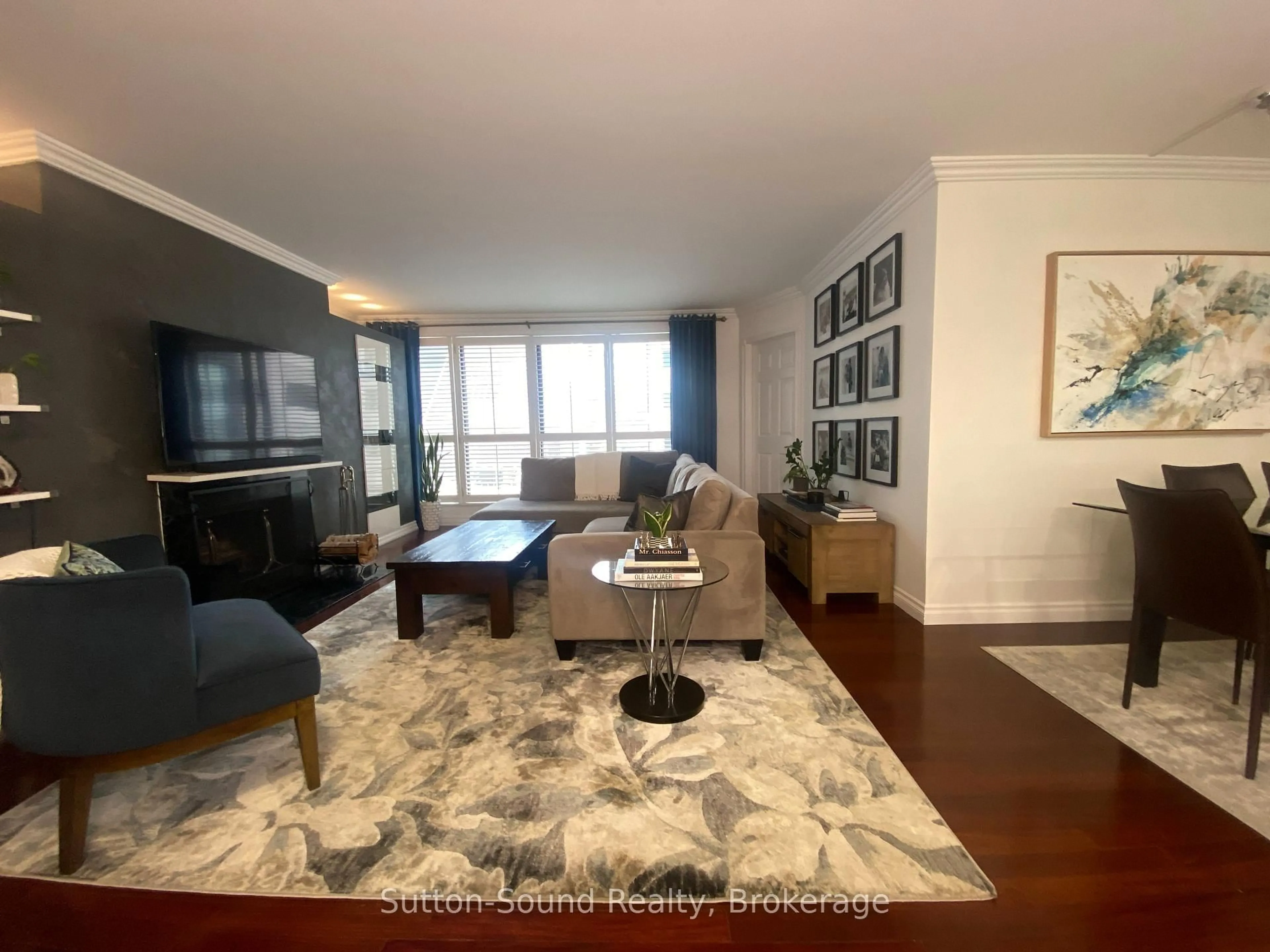 Living room with furniture, wood/laminate floor for 164 Cumberland St #606, Toronto Ontario M5R 1A8