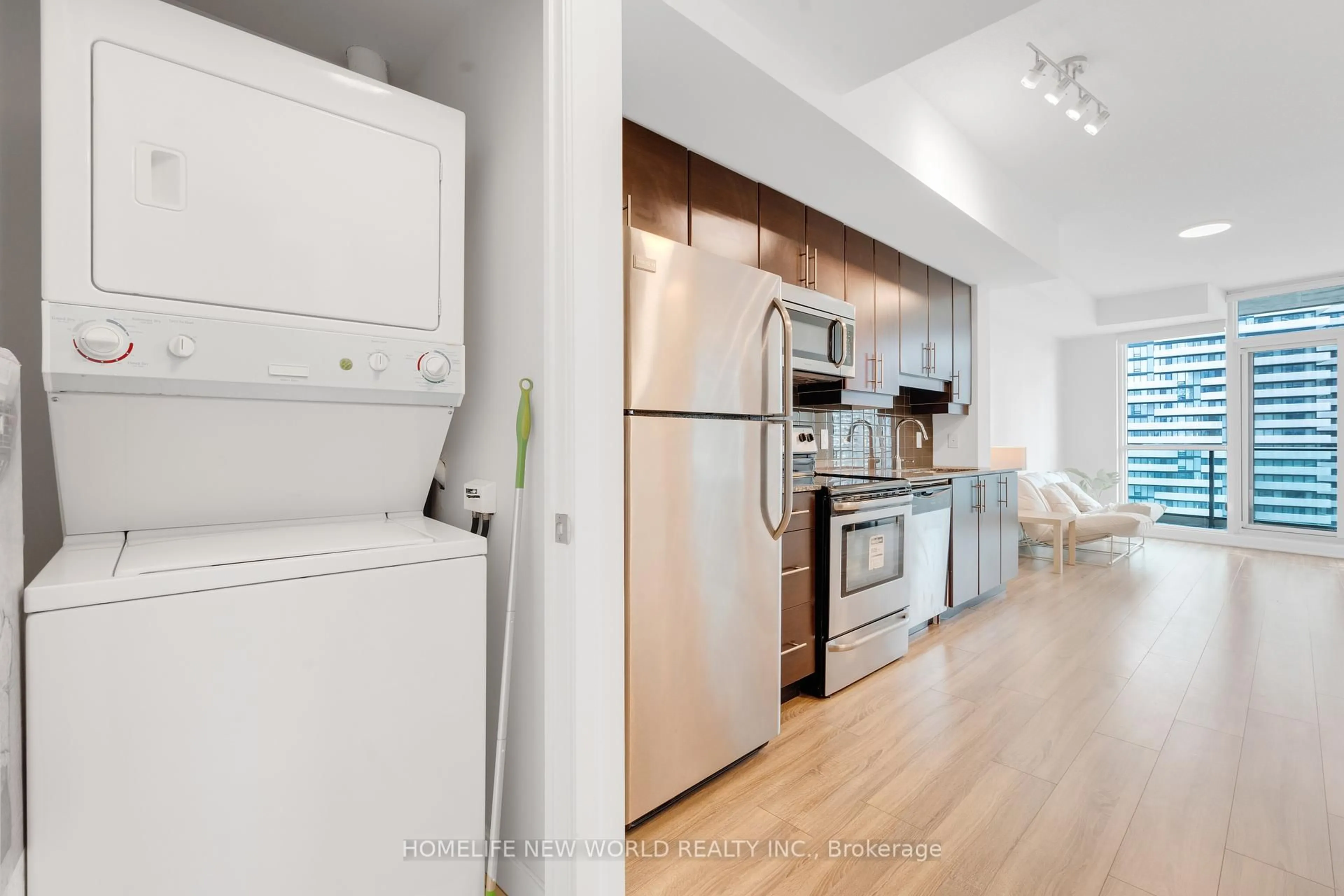 Kitchen with laundary machines, unknown for 33 Bay St #2502, Toronto Ontario M5J 2Z3