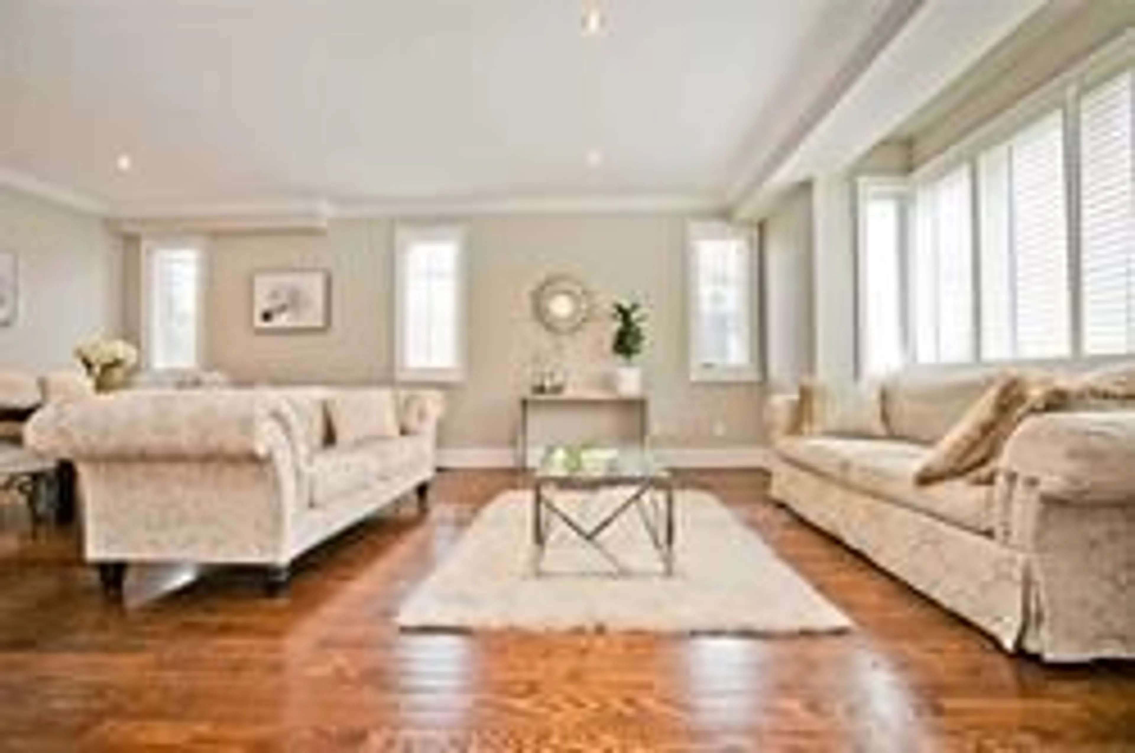 Living room with furniture, wood/laminate floor for 401 Longmore St, Toronto Ontario M2N 5C2