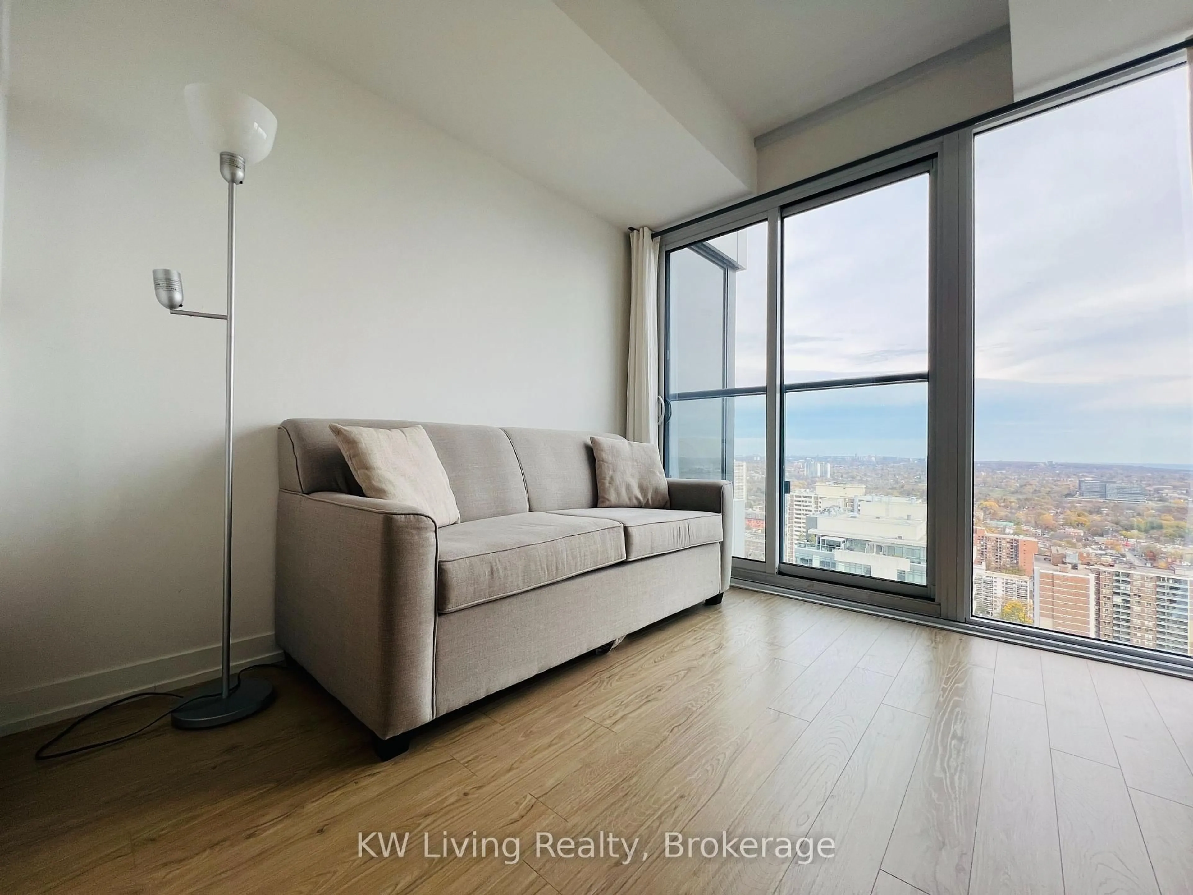 Living room with furniture, wood/laminate floor for 85 Wood St #4315, Toronto Ontario M4Y 0E8