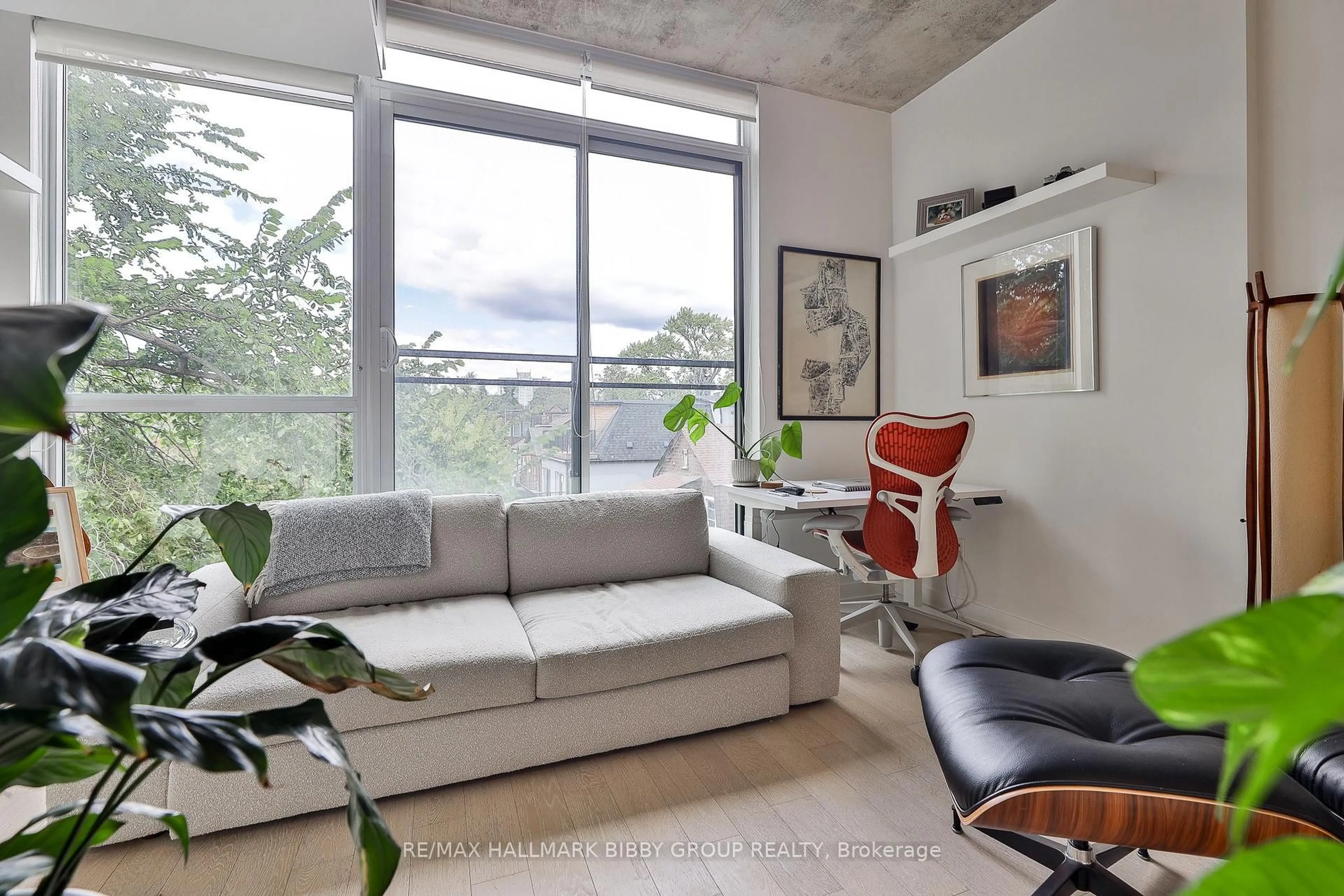 Living room with furniture, cement floor for 130 Rusholme Rd #309, Toronto Ontario M6H 1A7