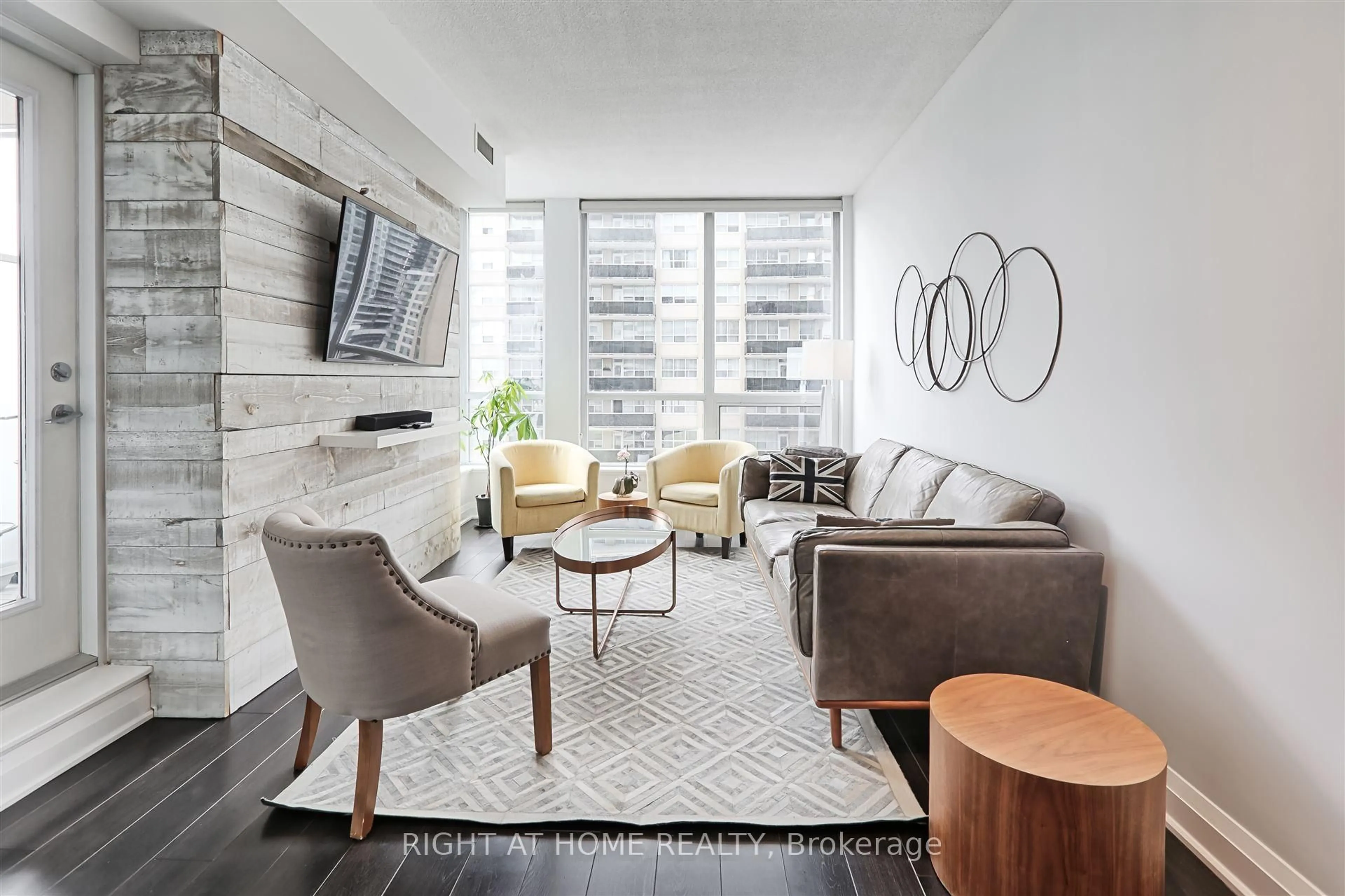 Living room with furniture, wood/laminate floor for 83 Redpath Ave #908, Toronto Ontario M4S 0A2