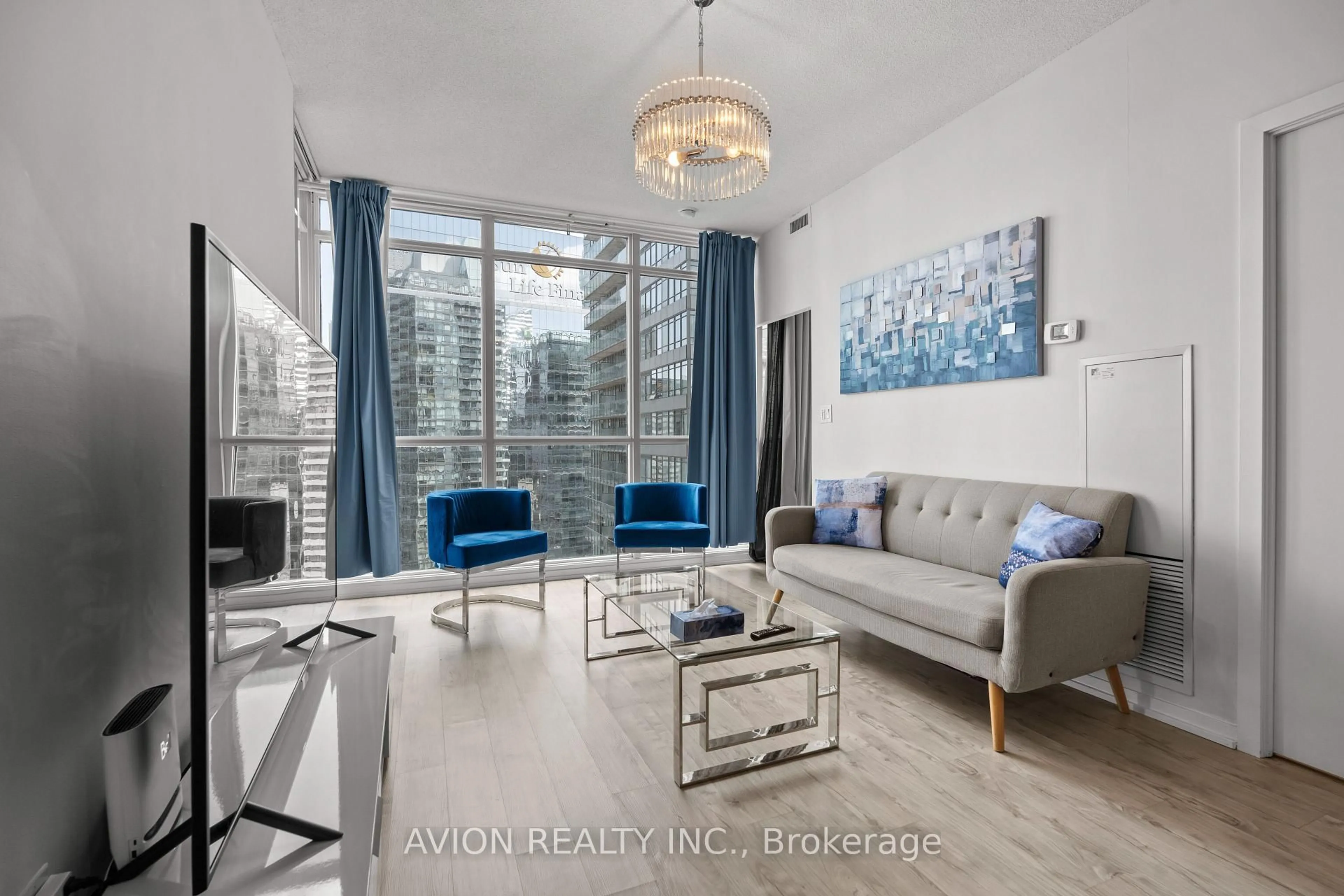 Living room with furniture, wood/laminate floor for 65 Bremner Blvd #3501, Toronto Ontario M5J 0A7