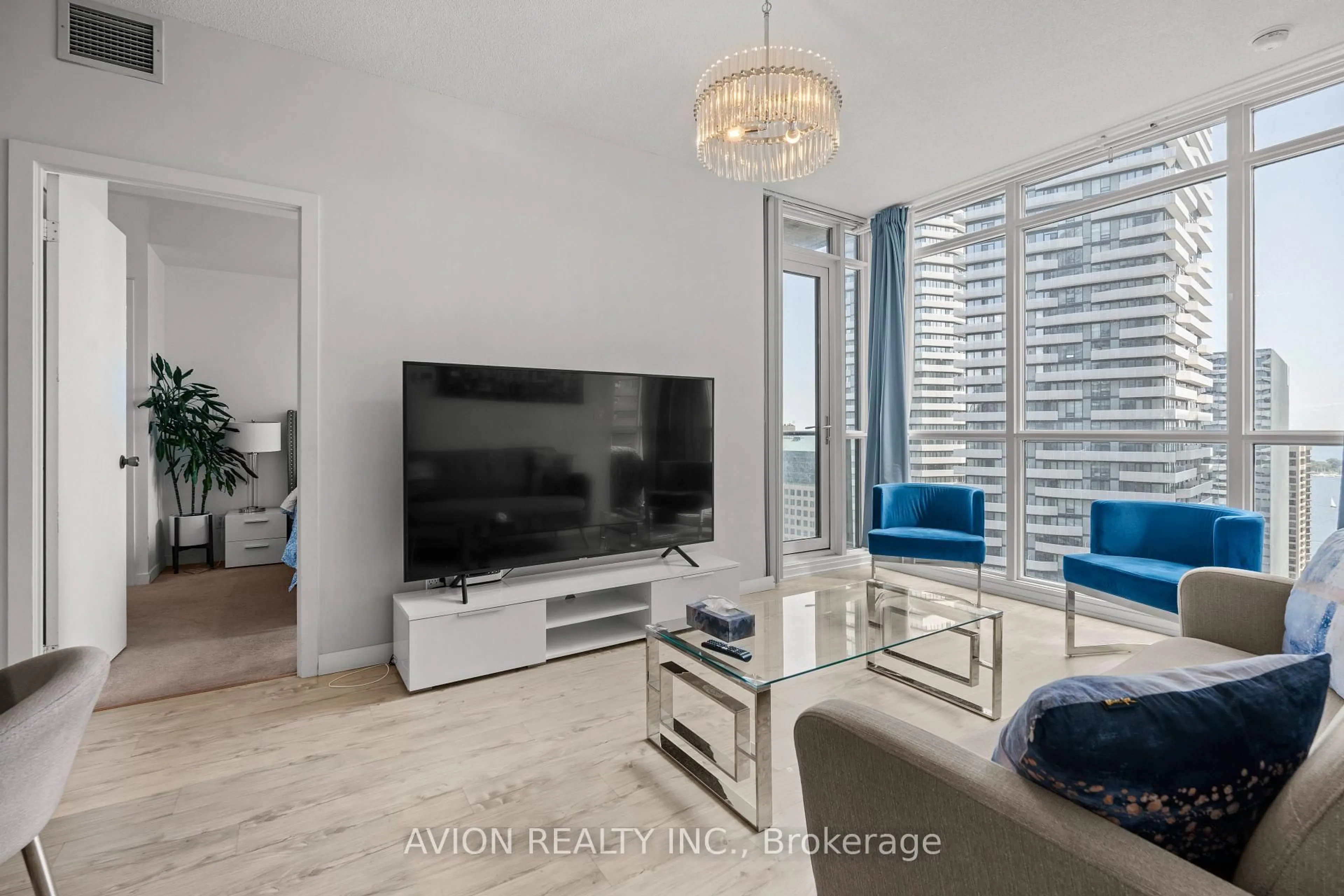 Living room with furniture, wood/laminate floor for 65 Bremner Blvd #3501, Toronto Ontario M5J 0A7