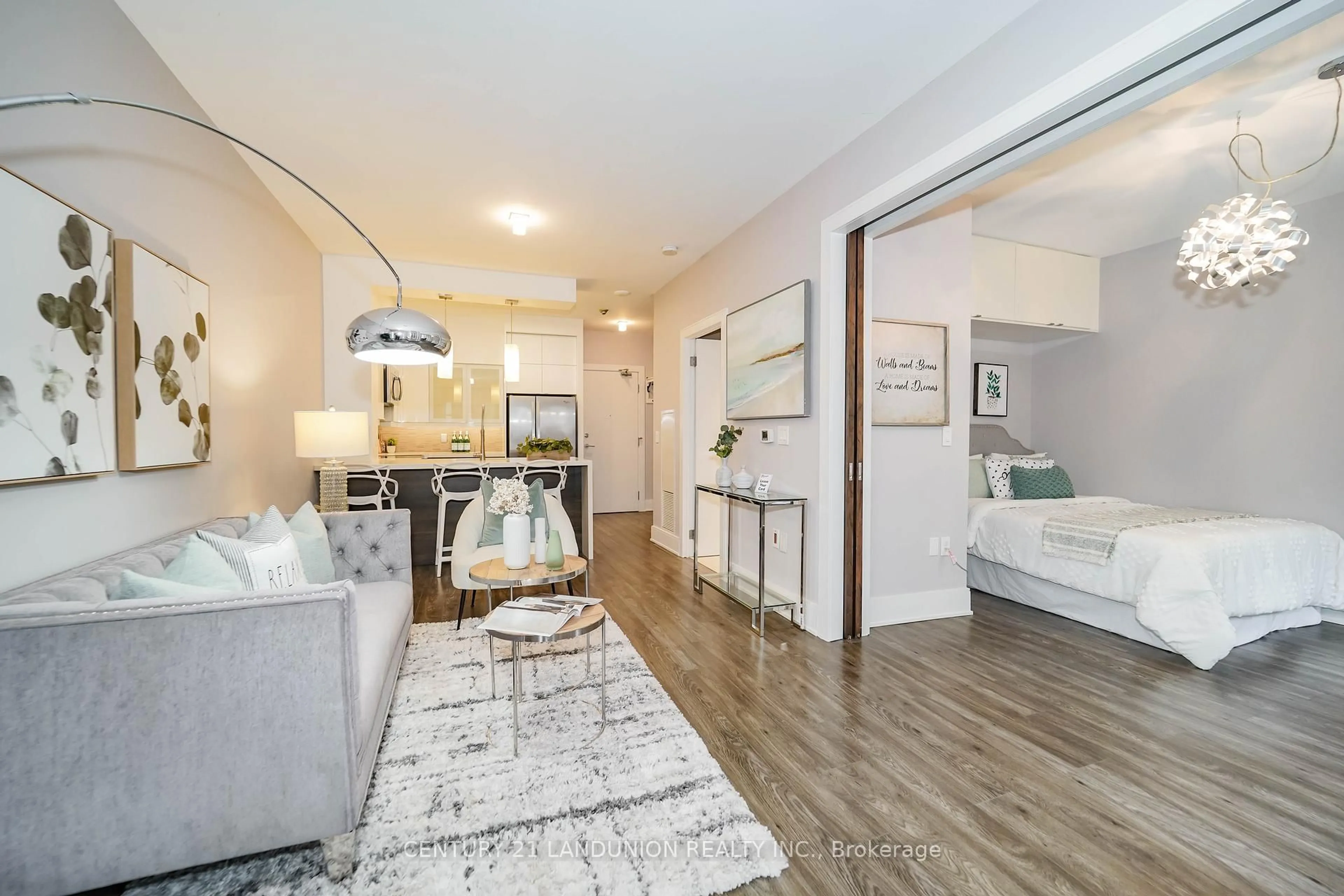 Living room with furniture, wood/laminate floor for 38 Kenaston Gdns #GV109, Toronto Ontario M2K 1G8