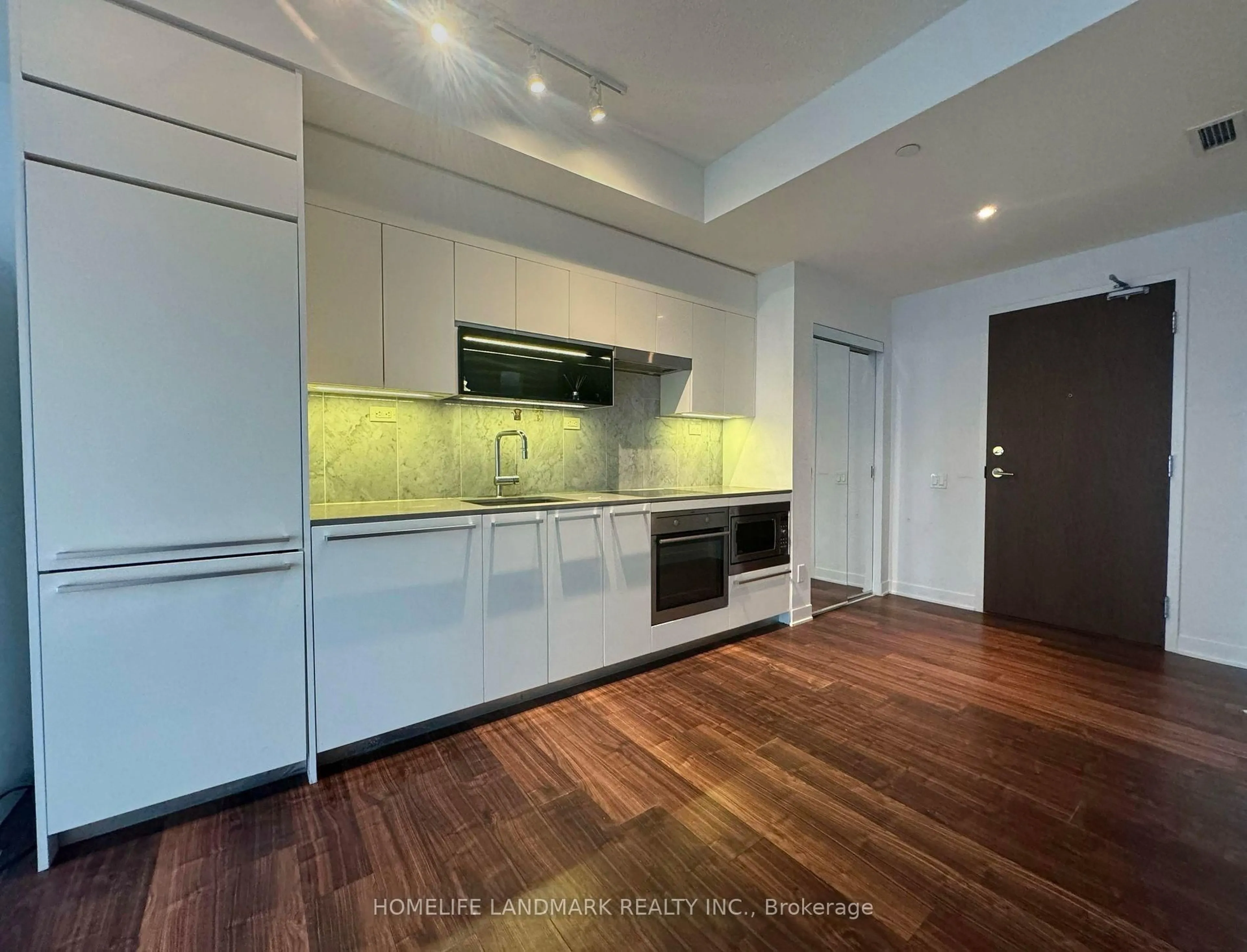 Open concept kitchen, wood/laminate floor for 90 queens Wharf Rd #608, Toronto Ontario M5V 0E6