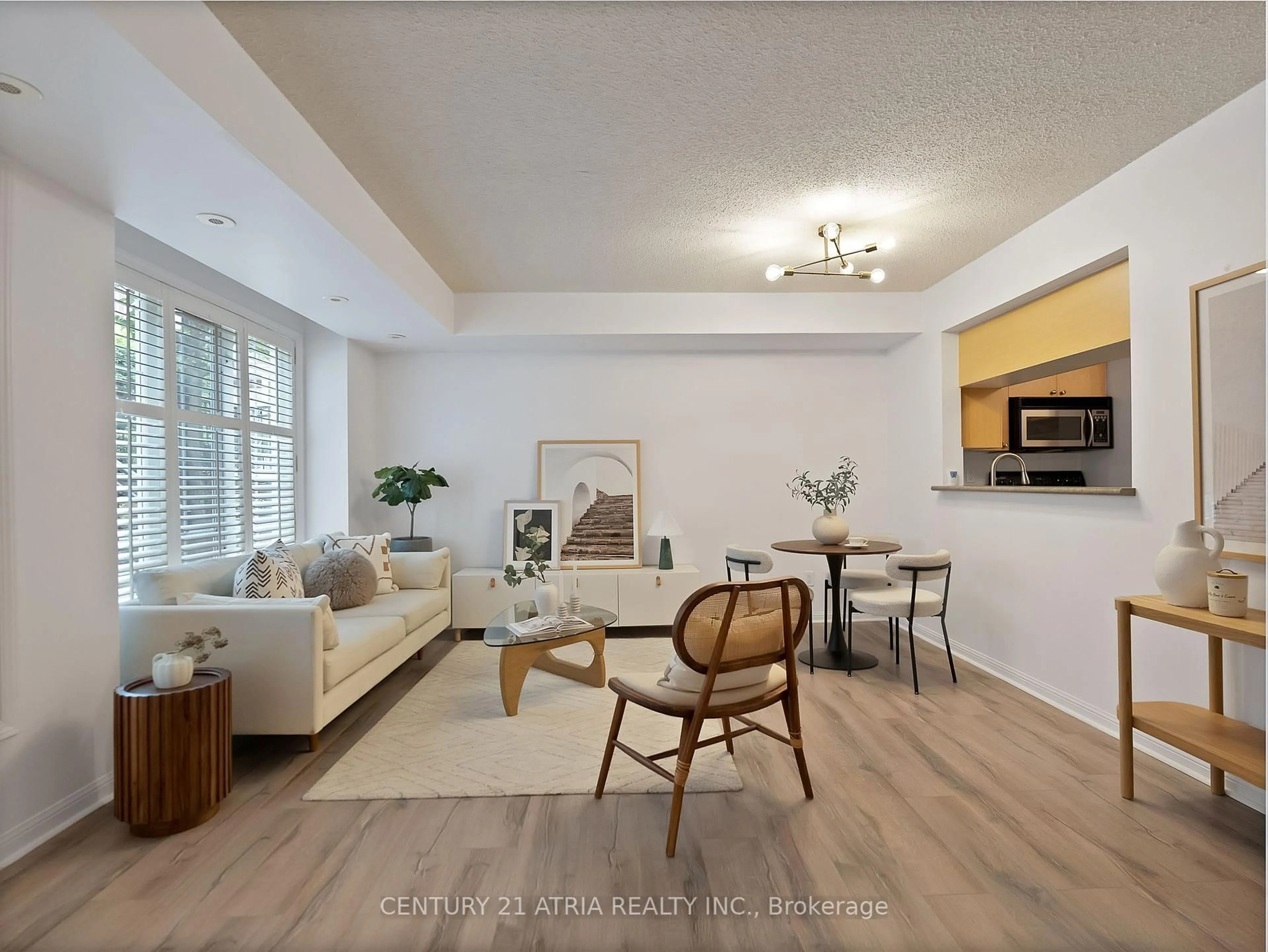 Living room with furniture, wood/laminate floor for 5 Everson Dr #1106, Toronto Ontario M2N 7C3