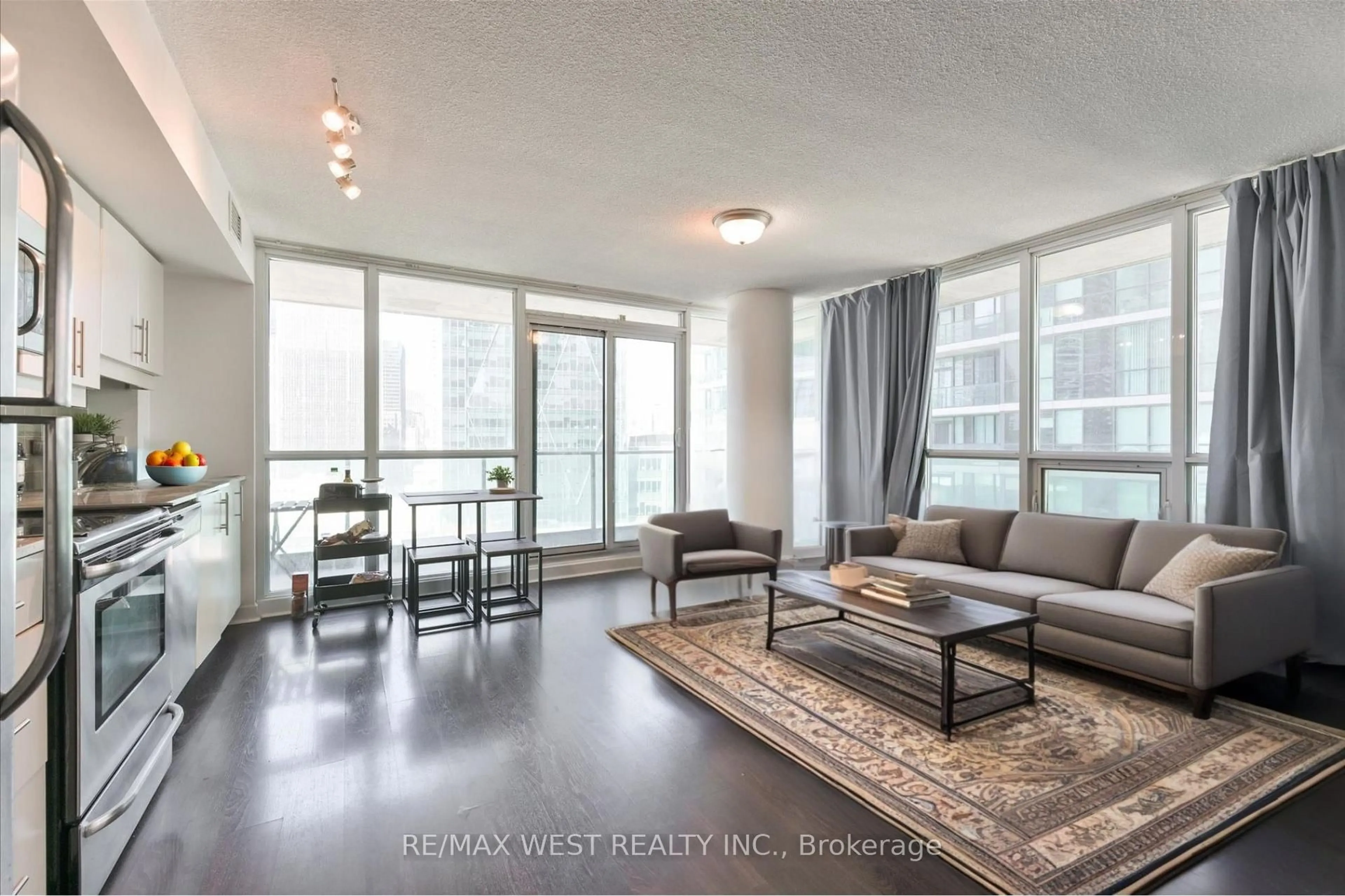 Living room with furniture, wood/laminate floor for 33 Bay St #1504, Toronto Ontario M5J 2Z3