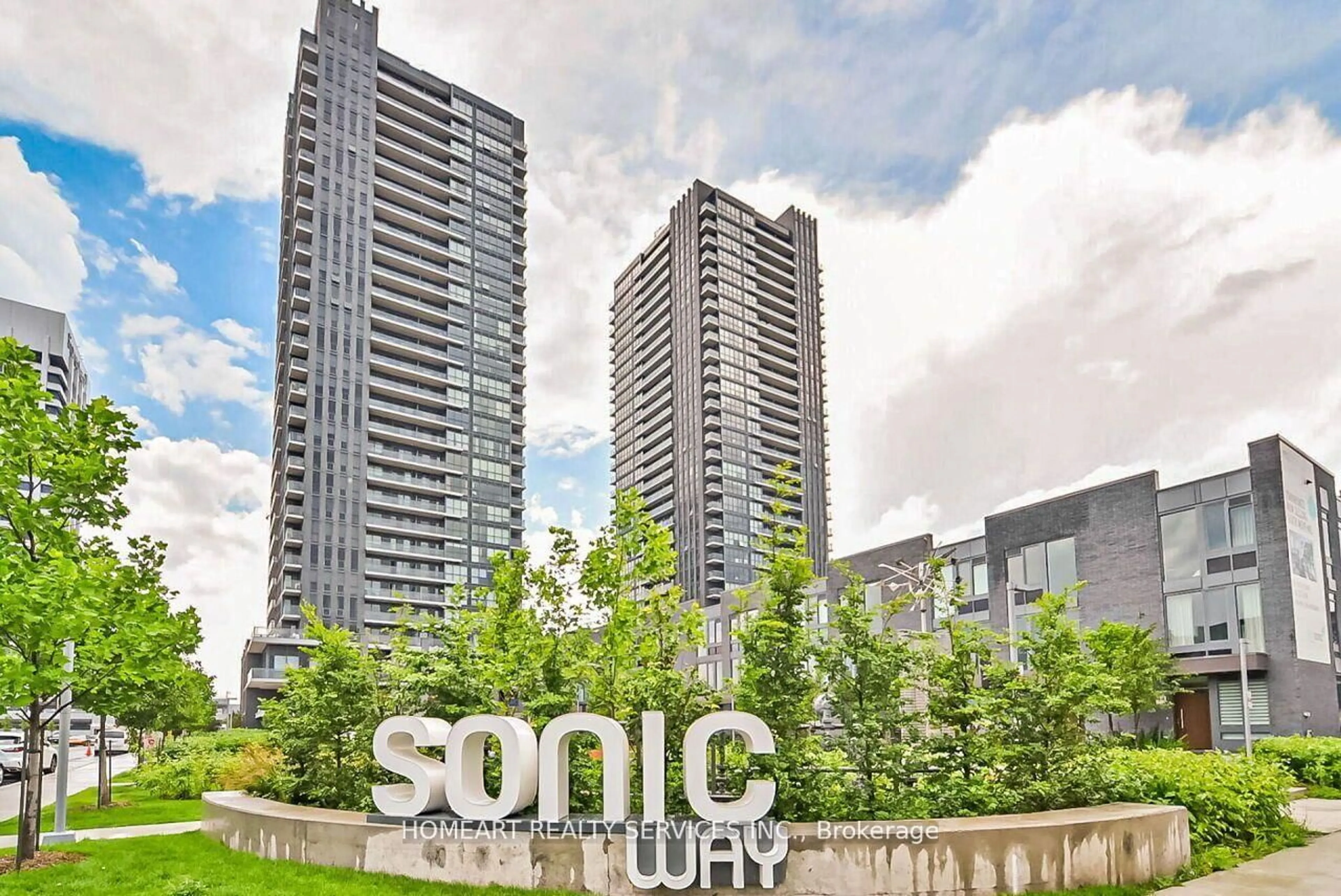 A pic from outside/outdoor area/front of a property/back of a property/a pic from drone, city buildings view from balcony for 2 Sonic Way #203, Toronto Ontario M3C 0P2