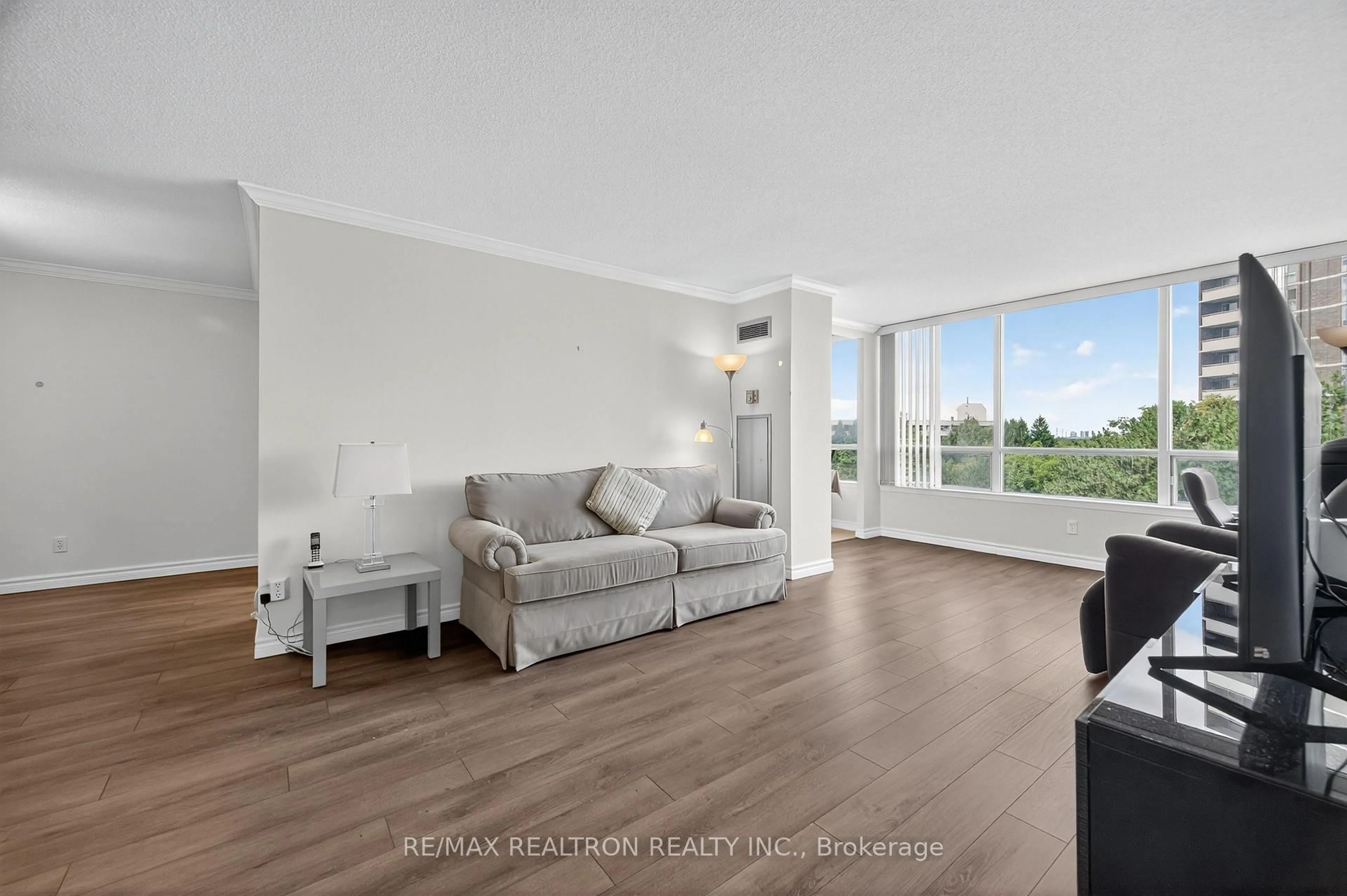 Living room with furniture, wood/laminate floor for 1101 Steeles Ave #602, Toronto Ontario M2R 3W5