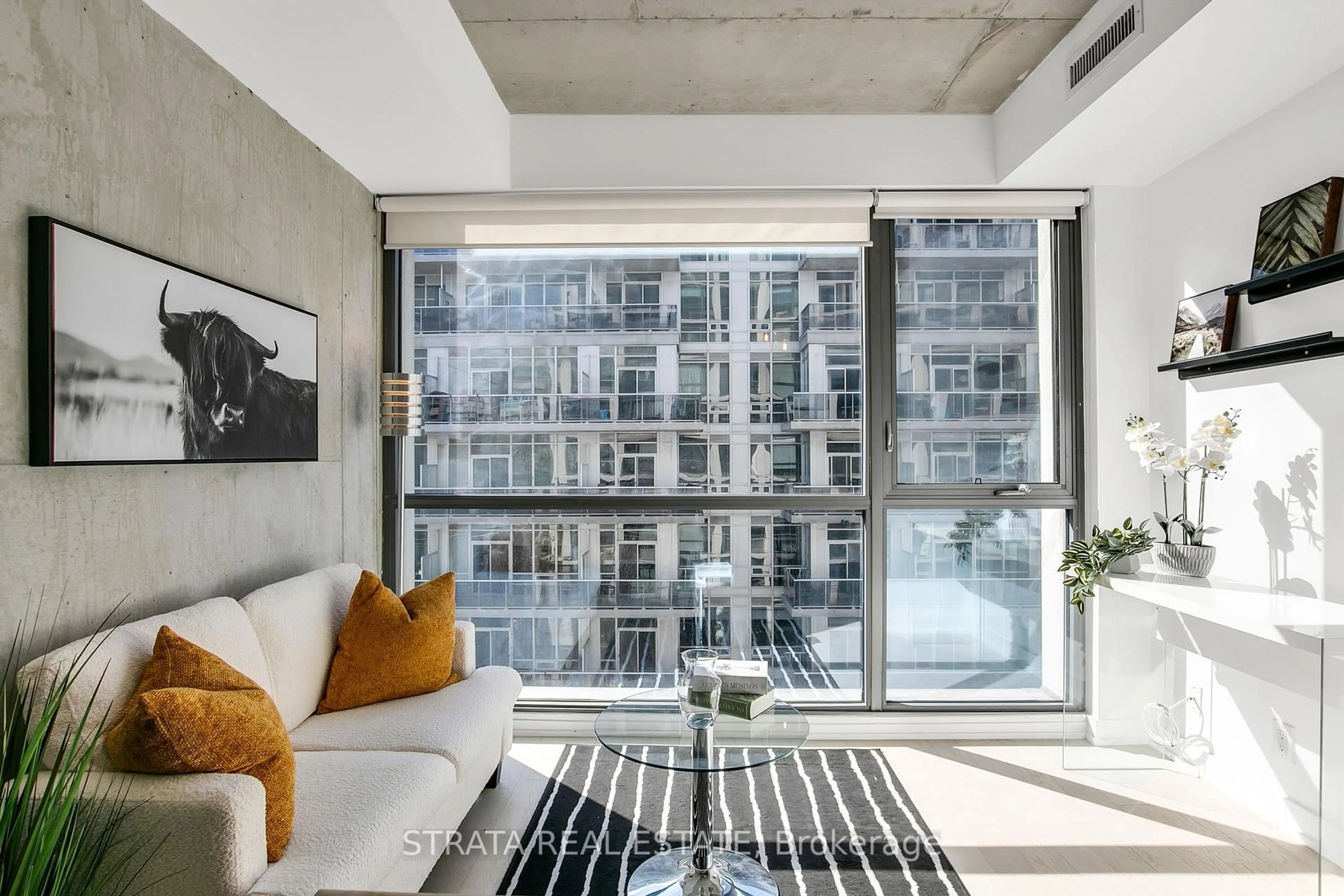 Living room with furniture, cement floor for 39 Brant St #512, Toronto Ontario M5V 2L9