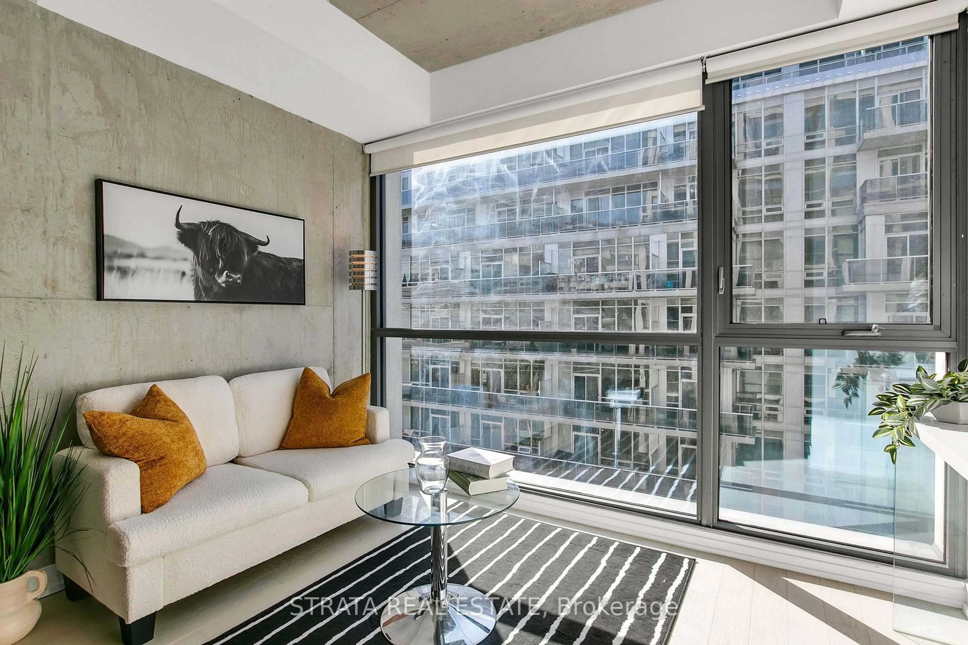 Living room with furniture, cement floor for 39 Brant St #512, Toronto Ontario M5V 2L9