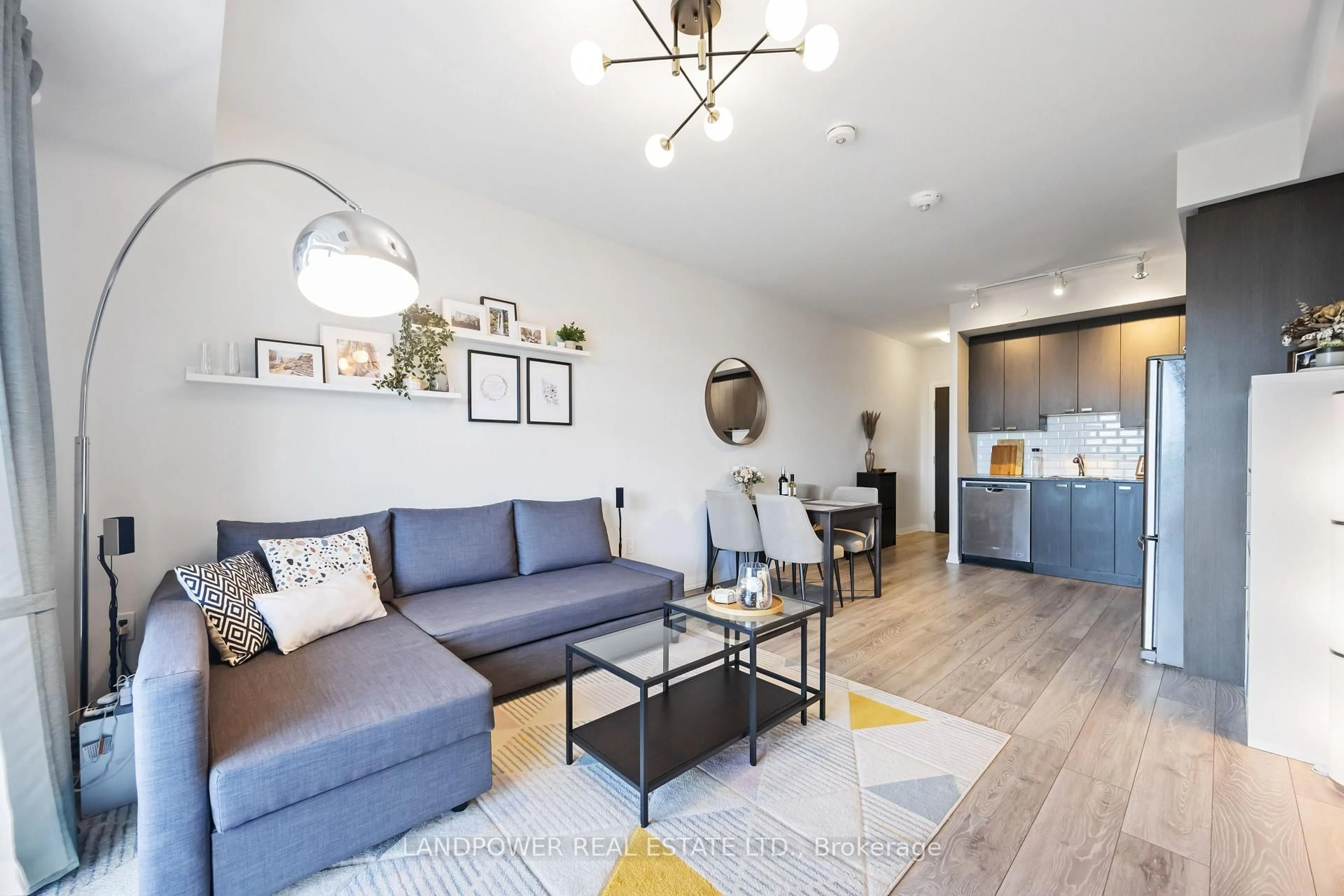 Living room with furniture, wood/laminate floor for 60 Ann O'Reilly Rd #767, Toronto Ontario M2J 0C8