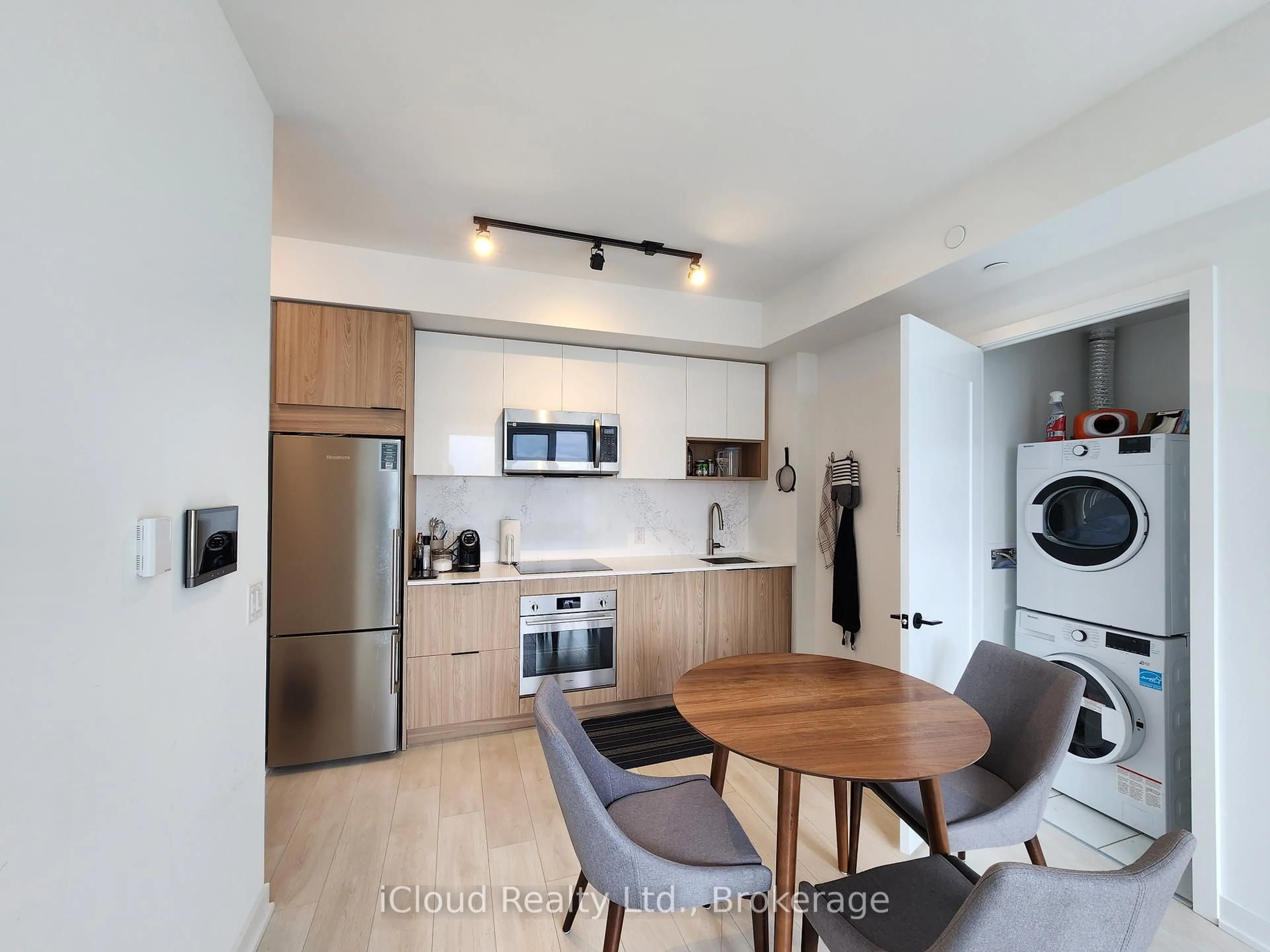 Open concept kitchen, wood/laminate floor for 5 Defries St #3012, Toronto Ontario M5A 0W7