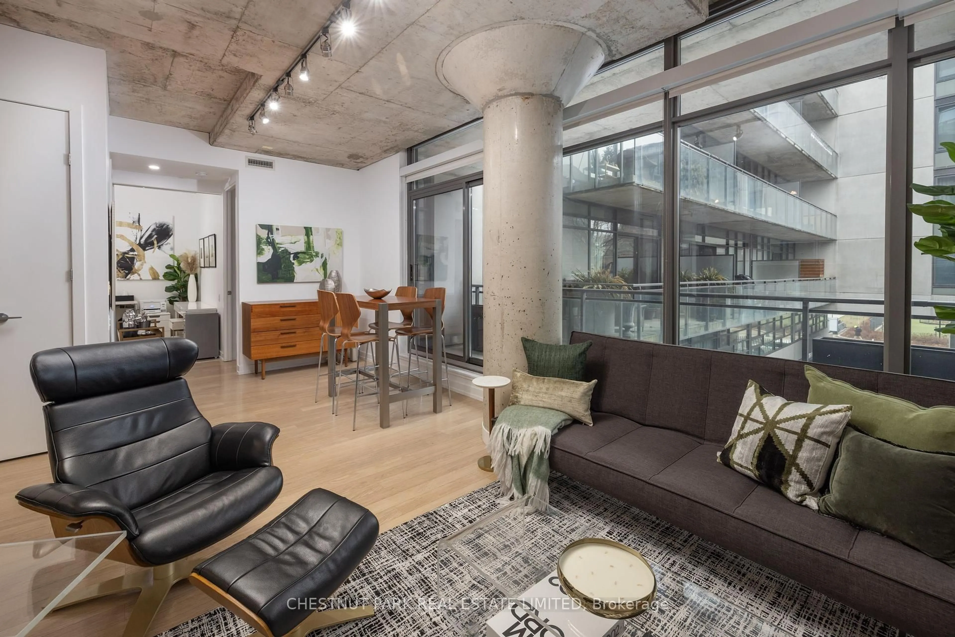Living room with furniture, cement floor for 10 Morrison St #301, Toronto Ontario M5V 2T8
