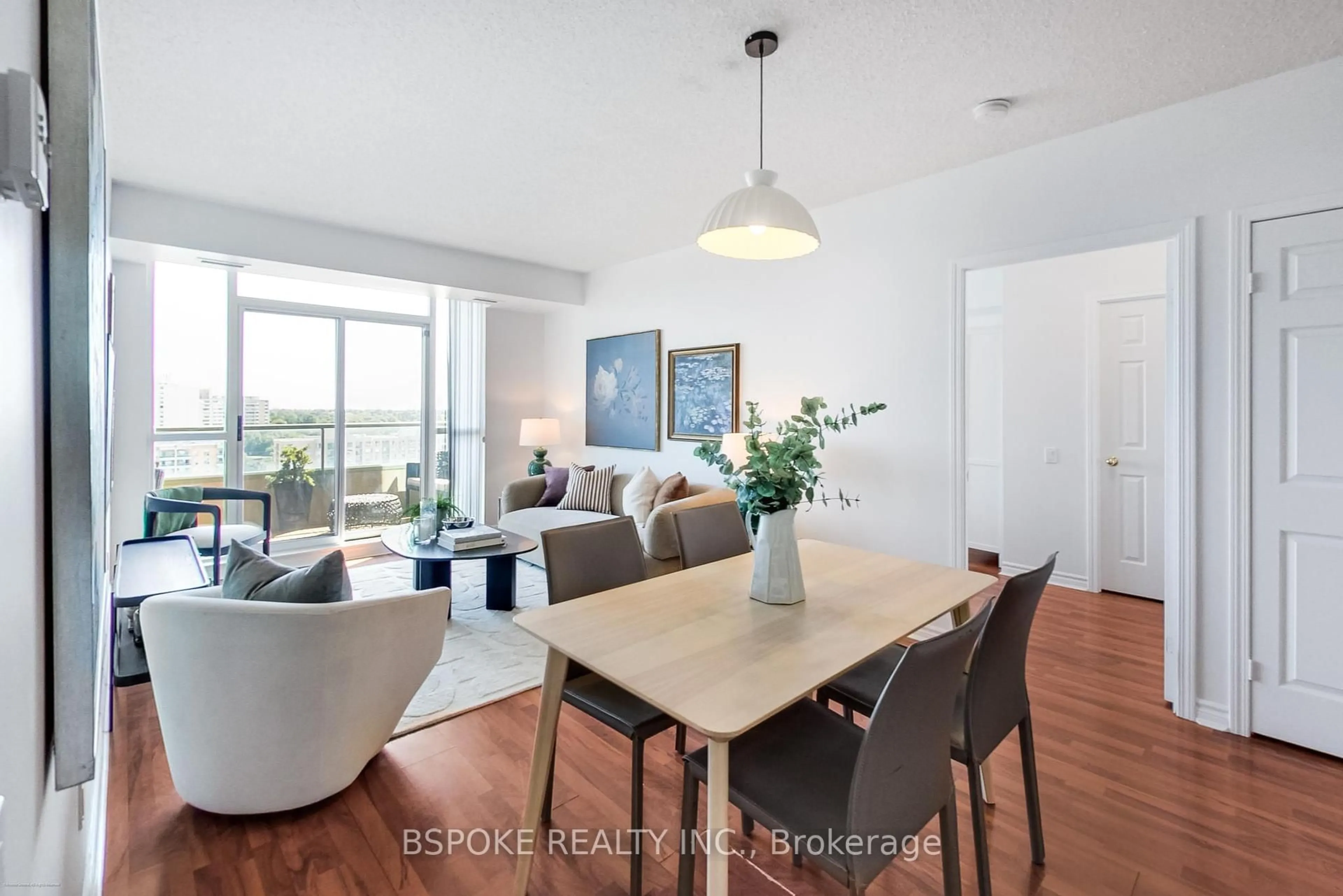 Living room with furniture, wood/laminate floor for 8 Covington Rd #1412, Toronto Ontario M6A 3E5