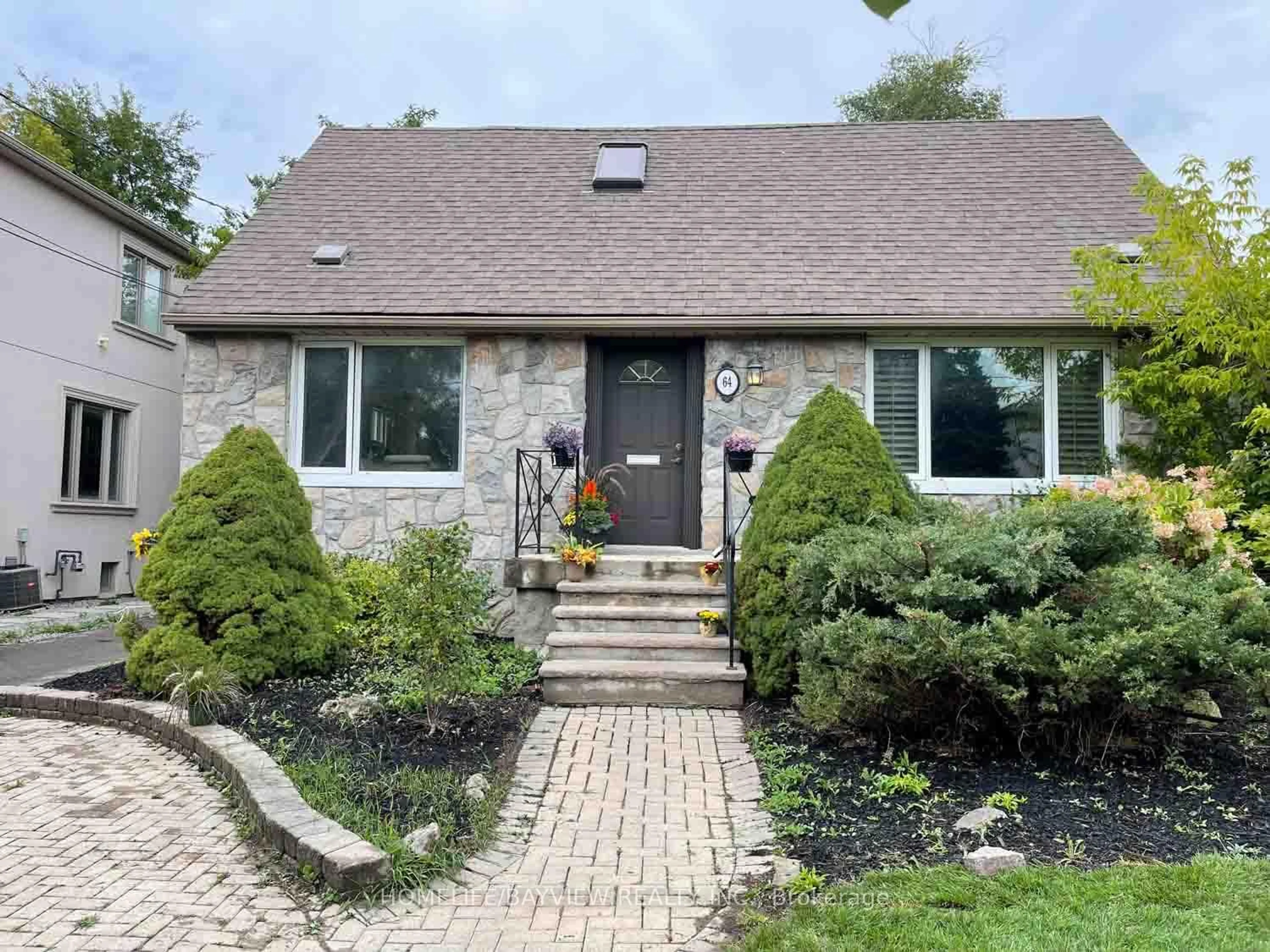 Home with brick exterior material, street for 64 Ridgevale Dr, Toronto Ontario M6A 1L1