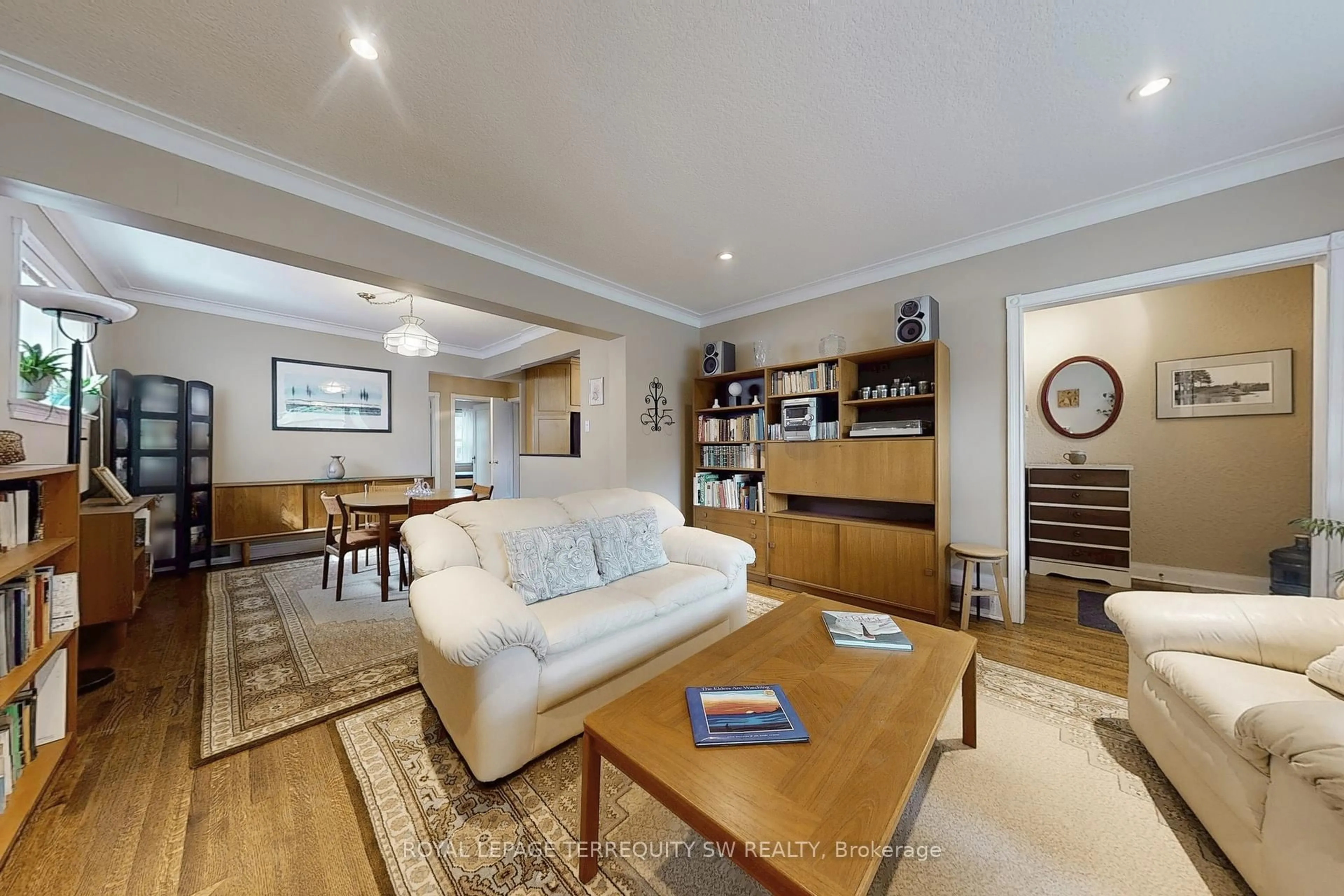 Living room with furniture, wood/laminate floor for 242 Joicey Blvd, Toronto Ontario M5M 2V7