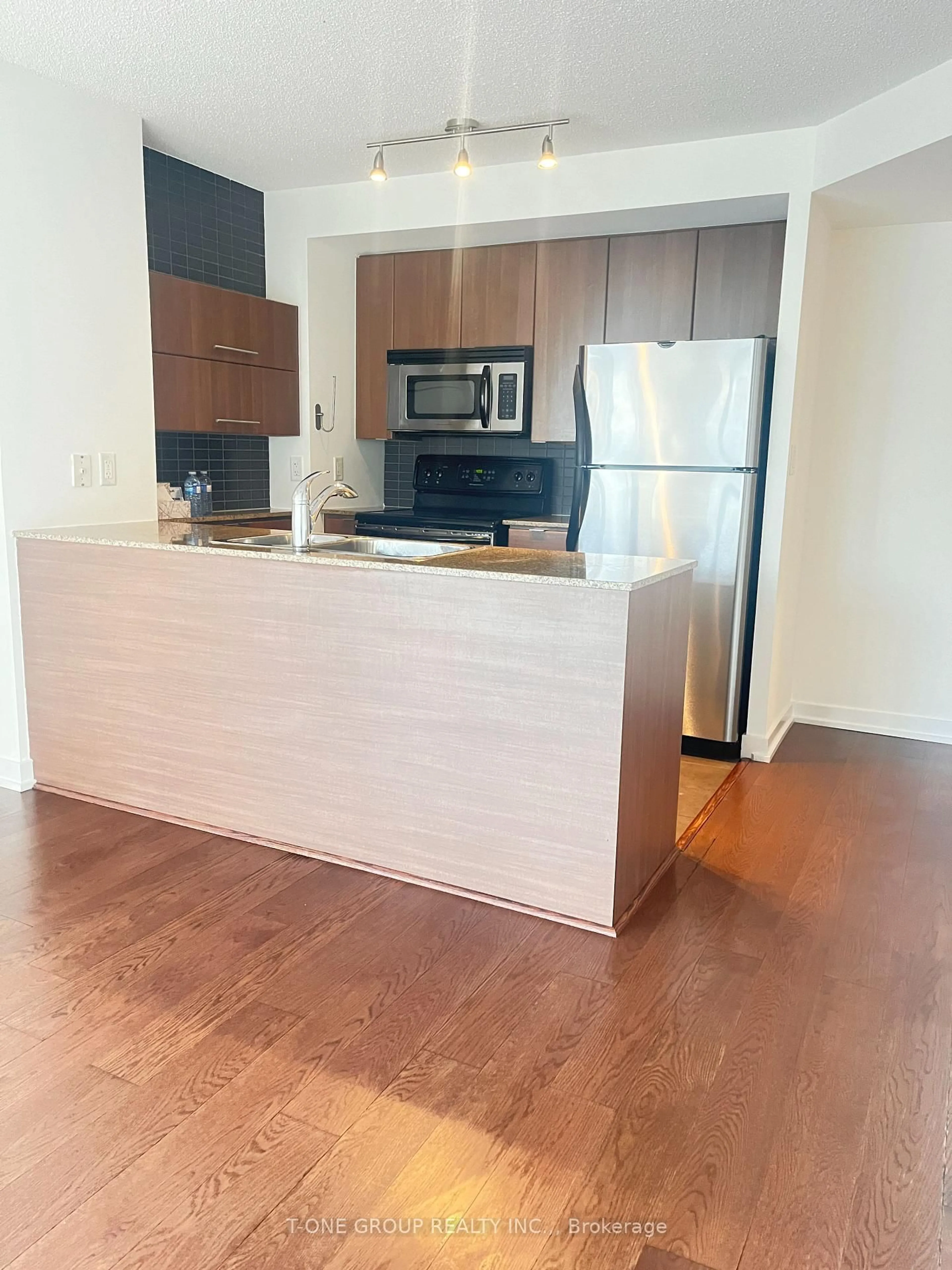 Open concept kitchen, wood/laminate floor for 11 Brunel Crt #510, Toronto Ontario M5V 3Y3