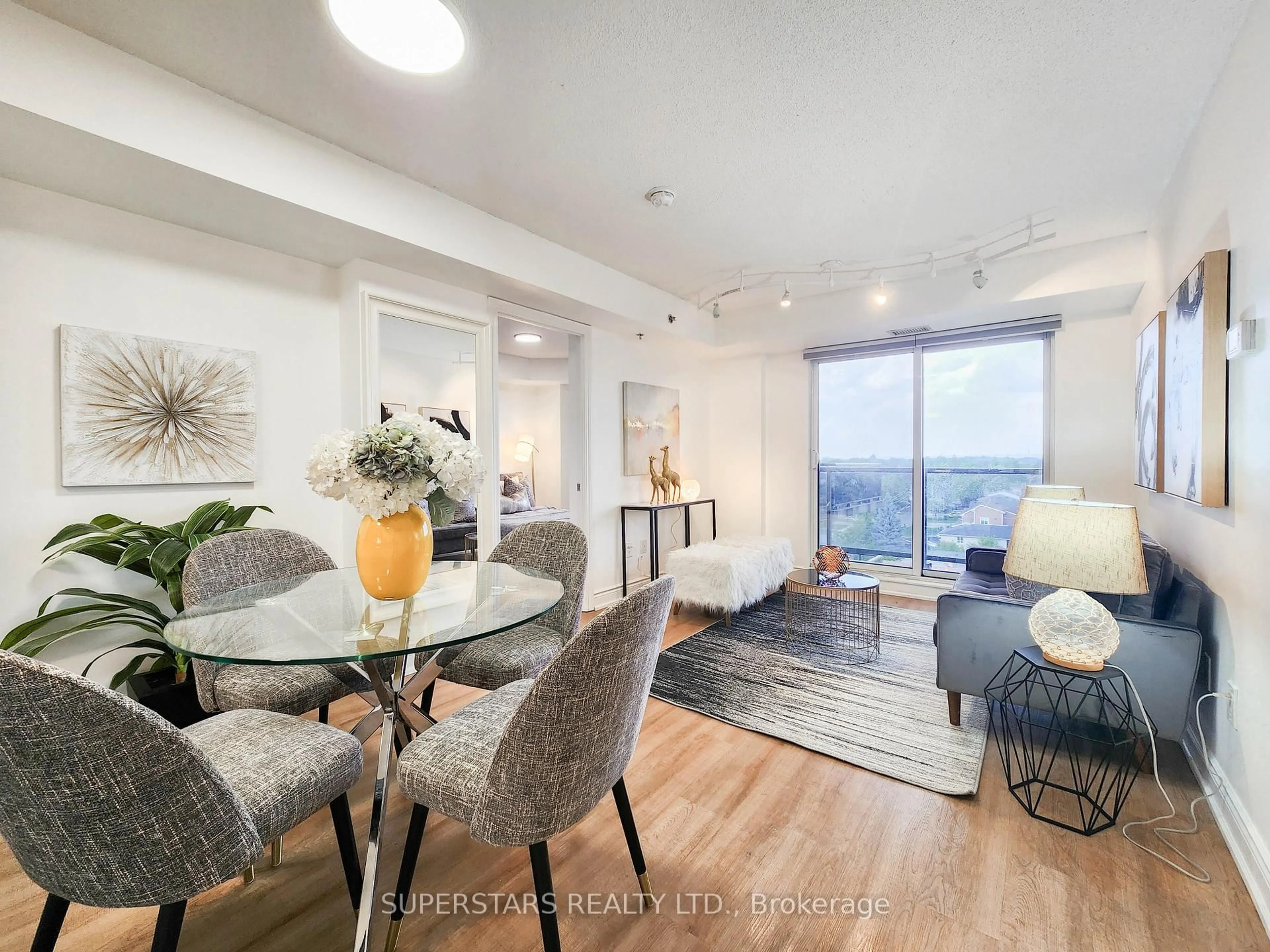 Living room with furniture, wood/laminate floor for 760 Sheppard Ave #701, Toronto Ontario M3H 2S8