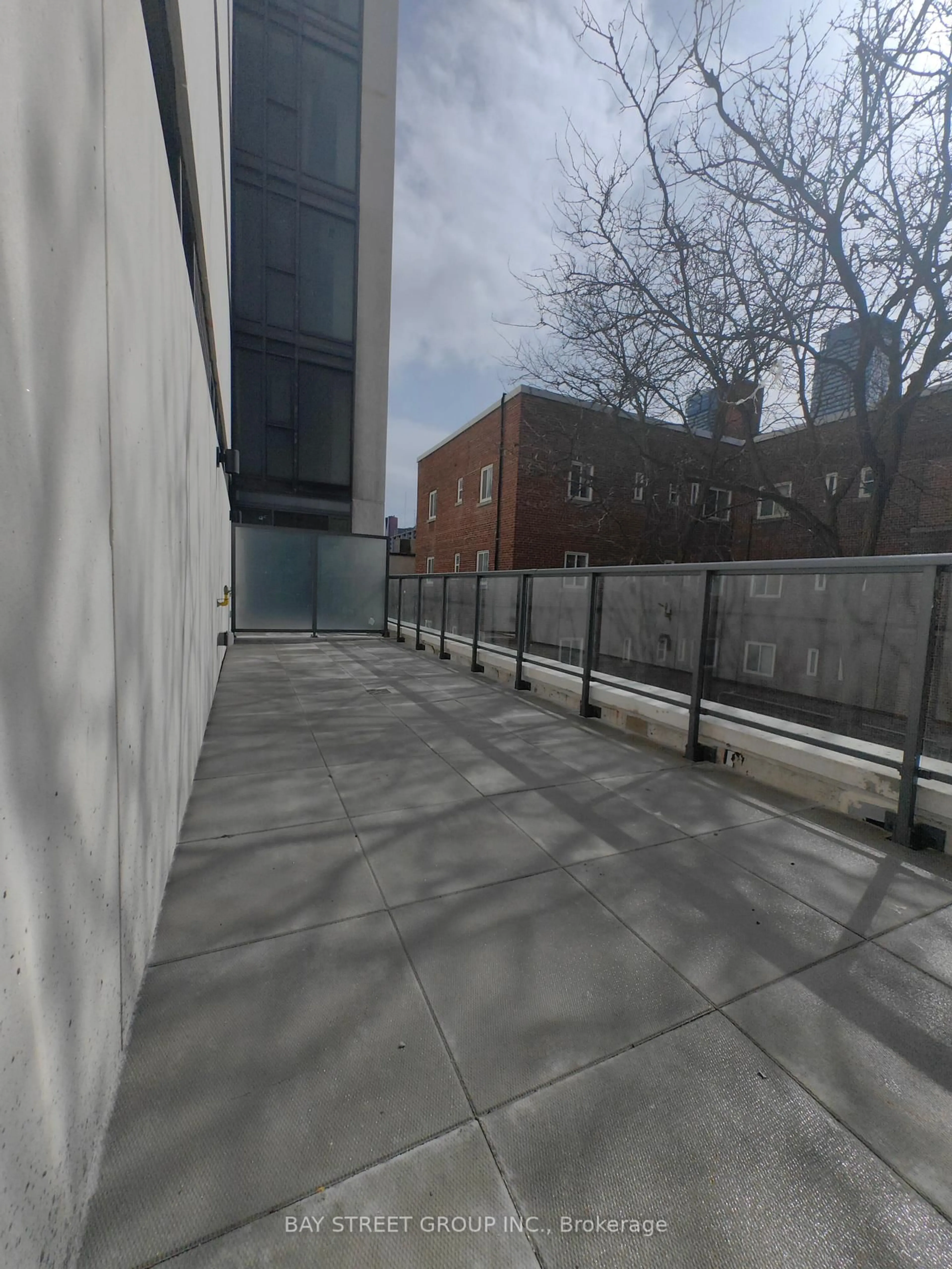 Patio, city buildings view from balcony for 81 Wellesley St #204, Toronto Ontario M4Y 0C5