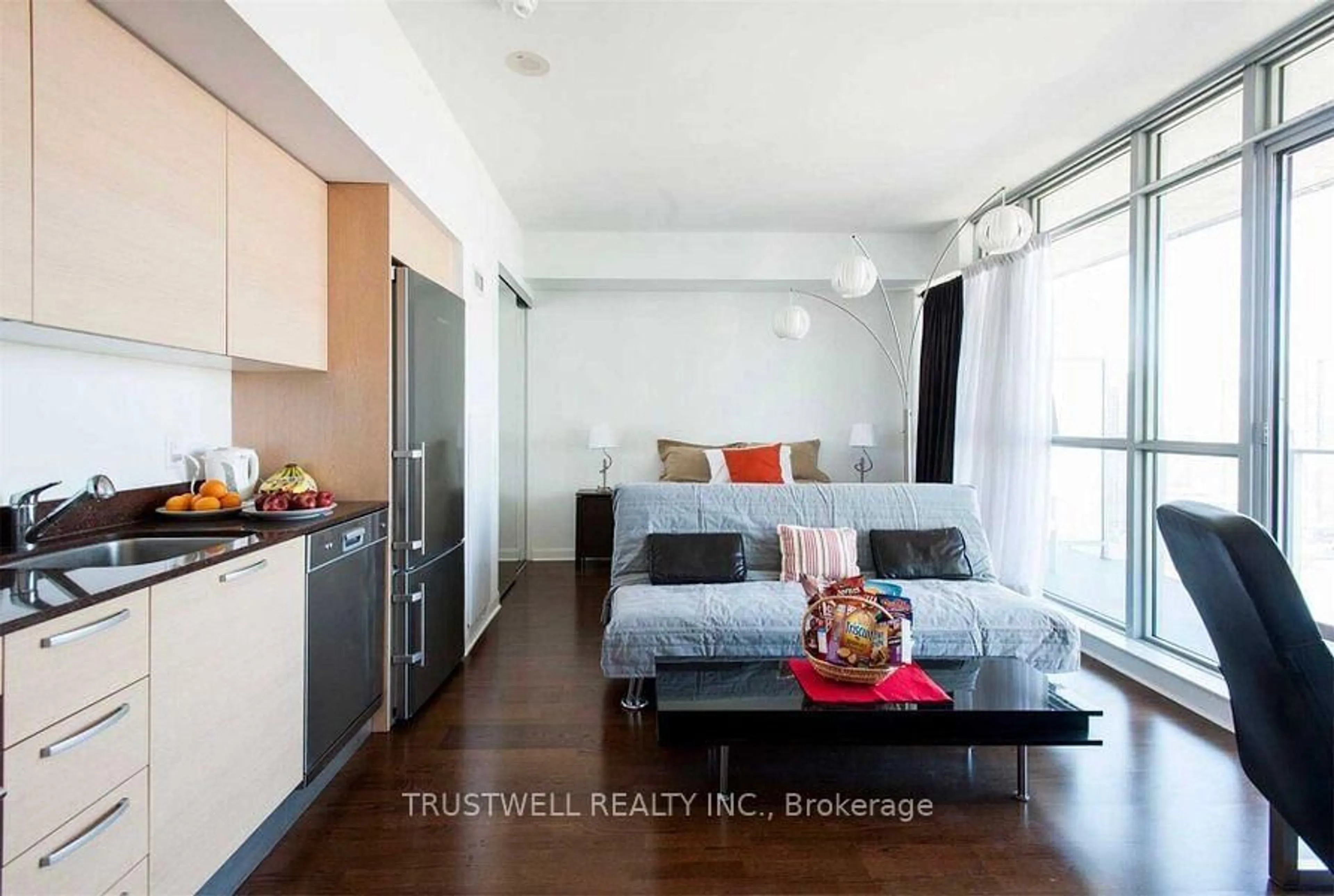 Living room with furniture, wood/laminate floor for 375 King St #2810, Toronto Ontario M5V 1K5