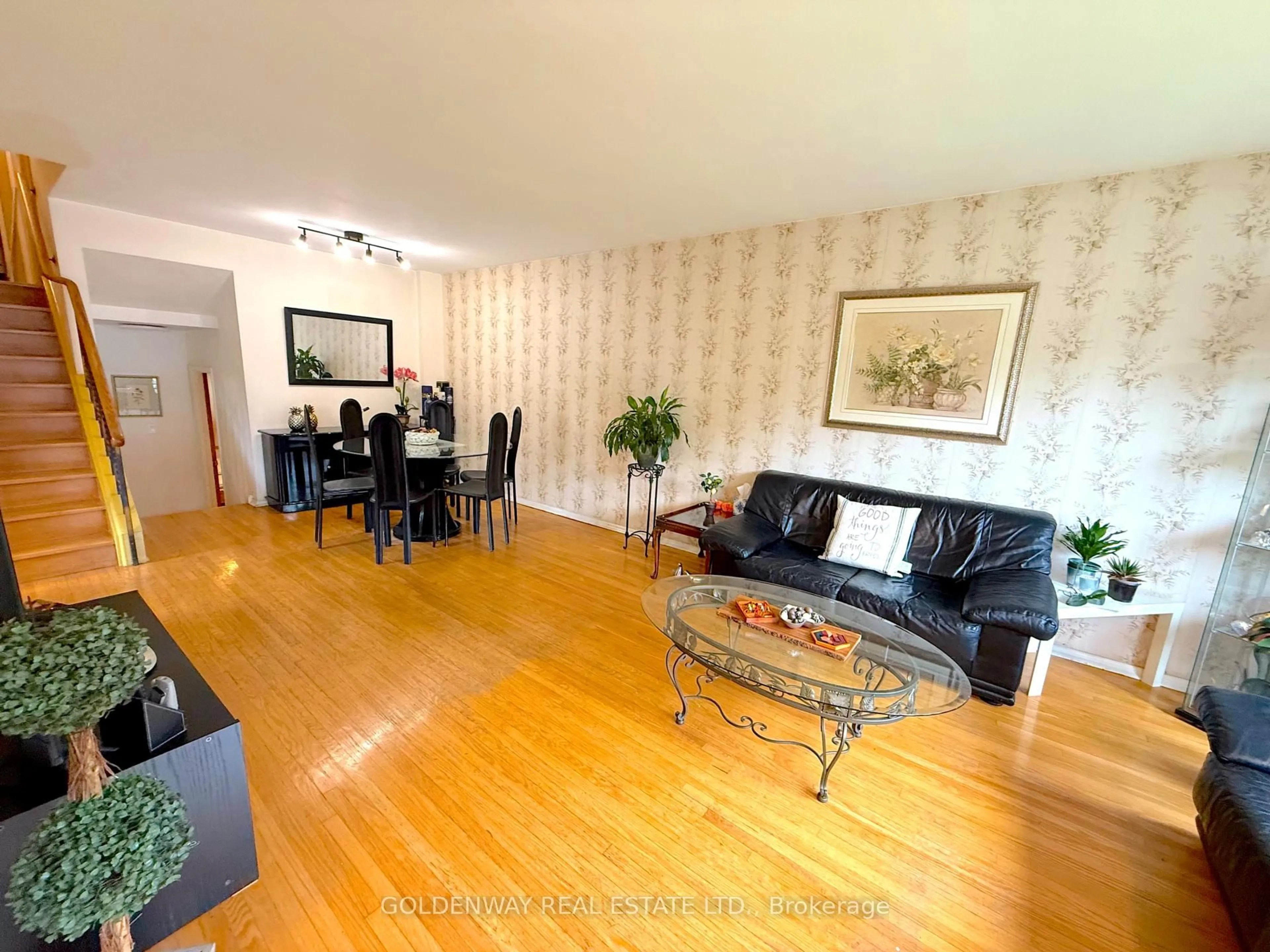 Living room with furniture, wood/laminate floor for 68 Fortrose Cres, Toronto Ontario M3A 2H1