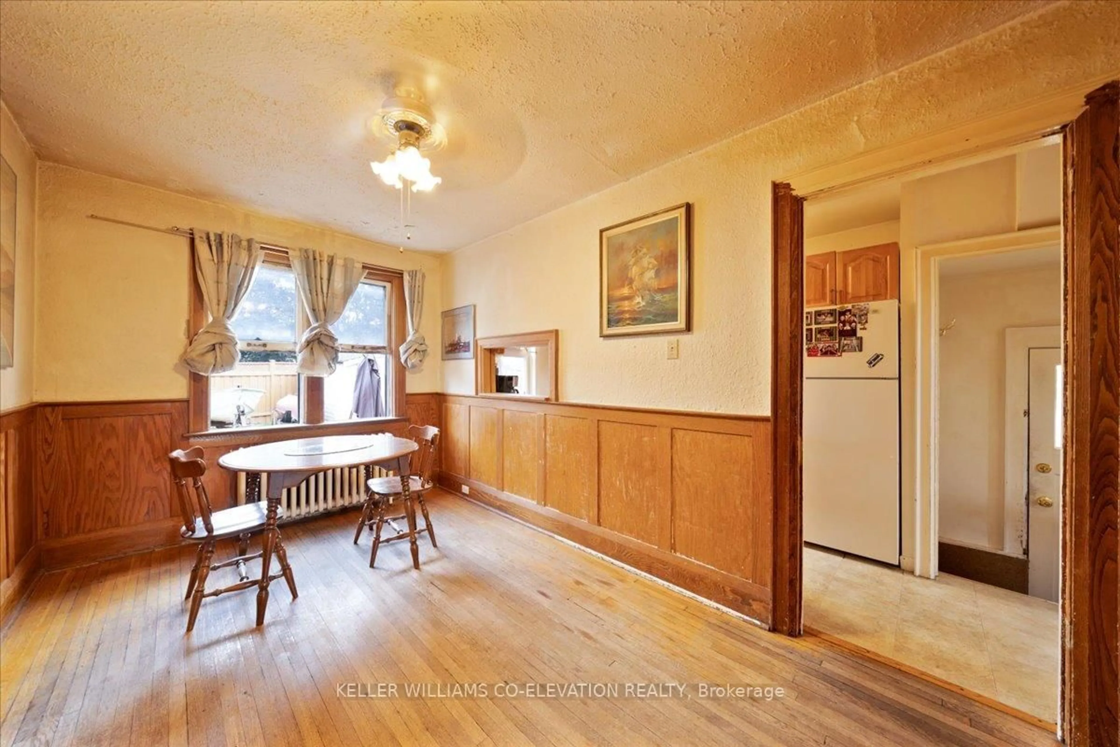 Dining room, wood/laminate floor for 149 Alameda Ave, Toronto Ontario M6C 3X1