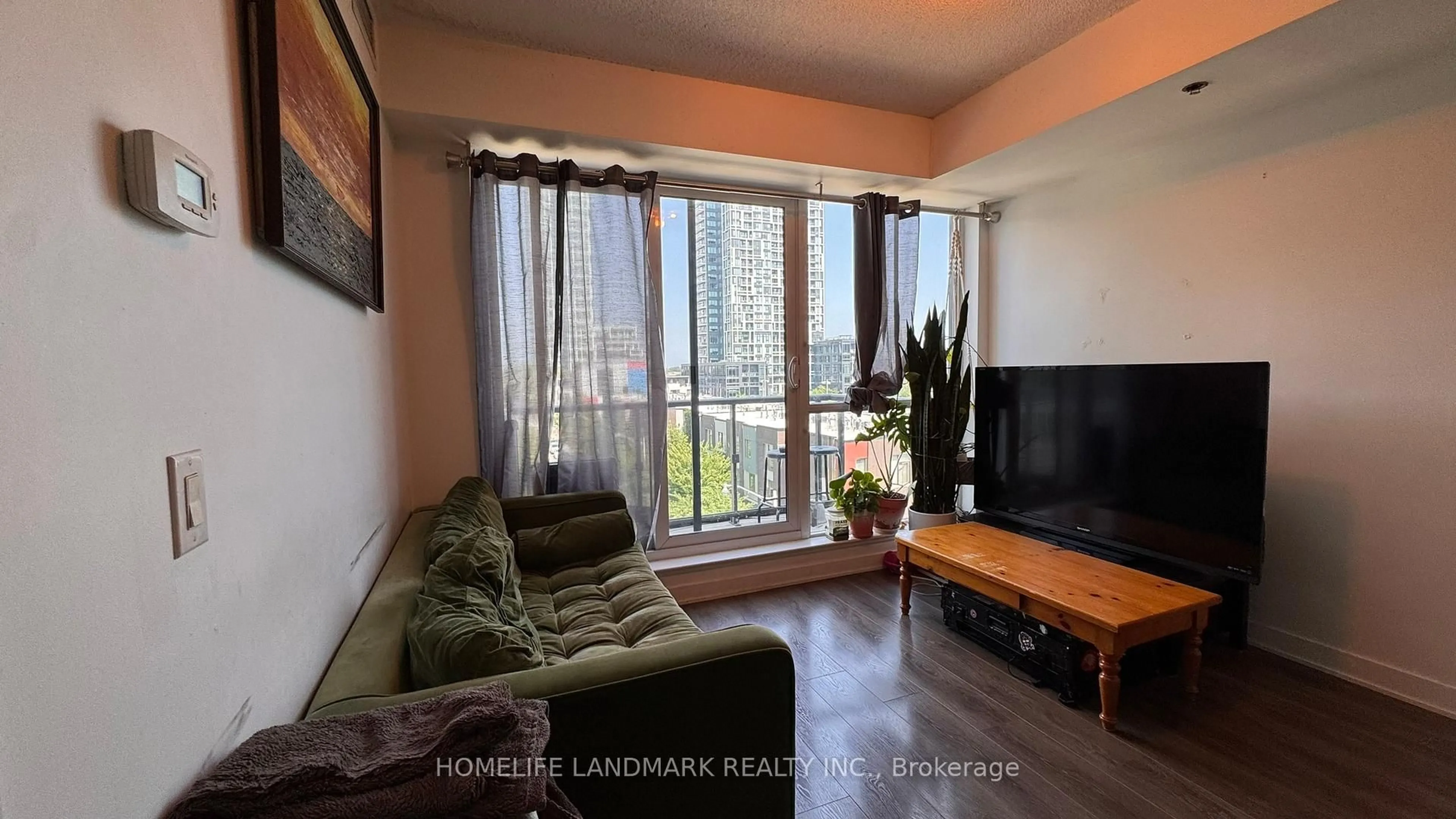 Living room with furniture, wood/laminate floor for 170 Sumach St #504, Toronto Ontario M5A 0C3