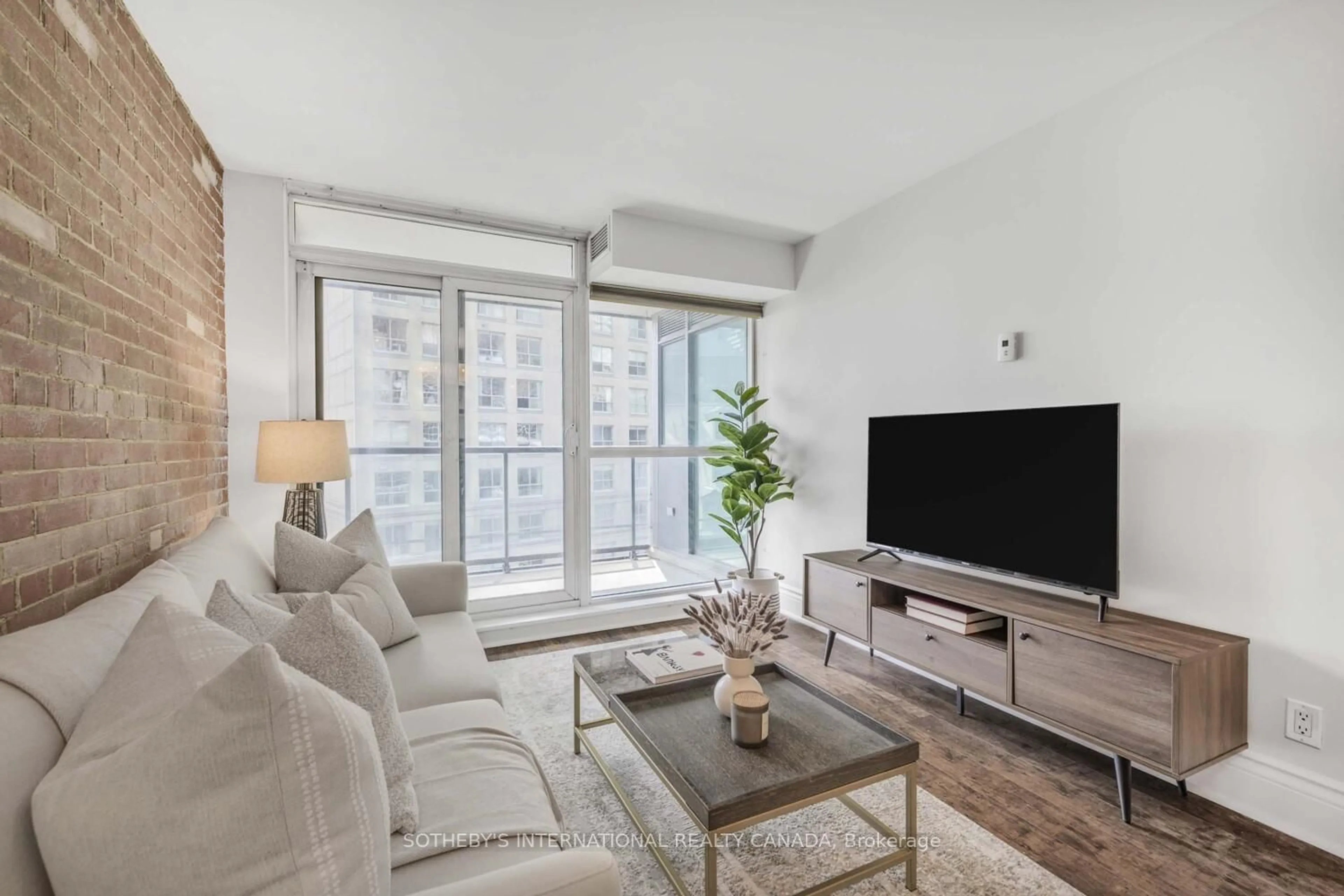 Living room with furniture, unknown for 1 Scott St #803, Toronto Ontario M5E 1A1