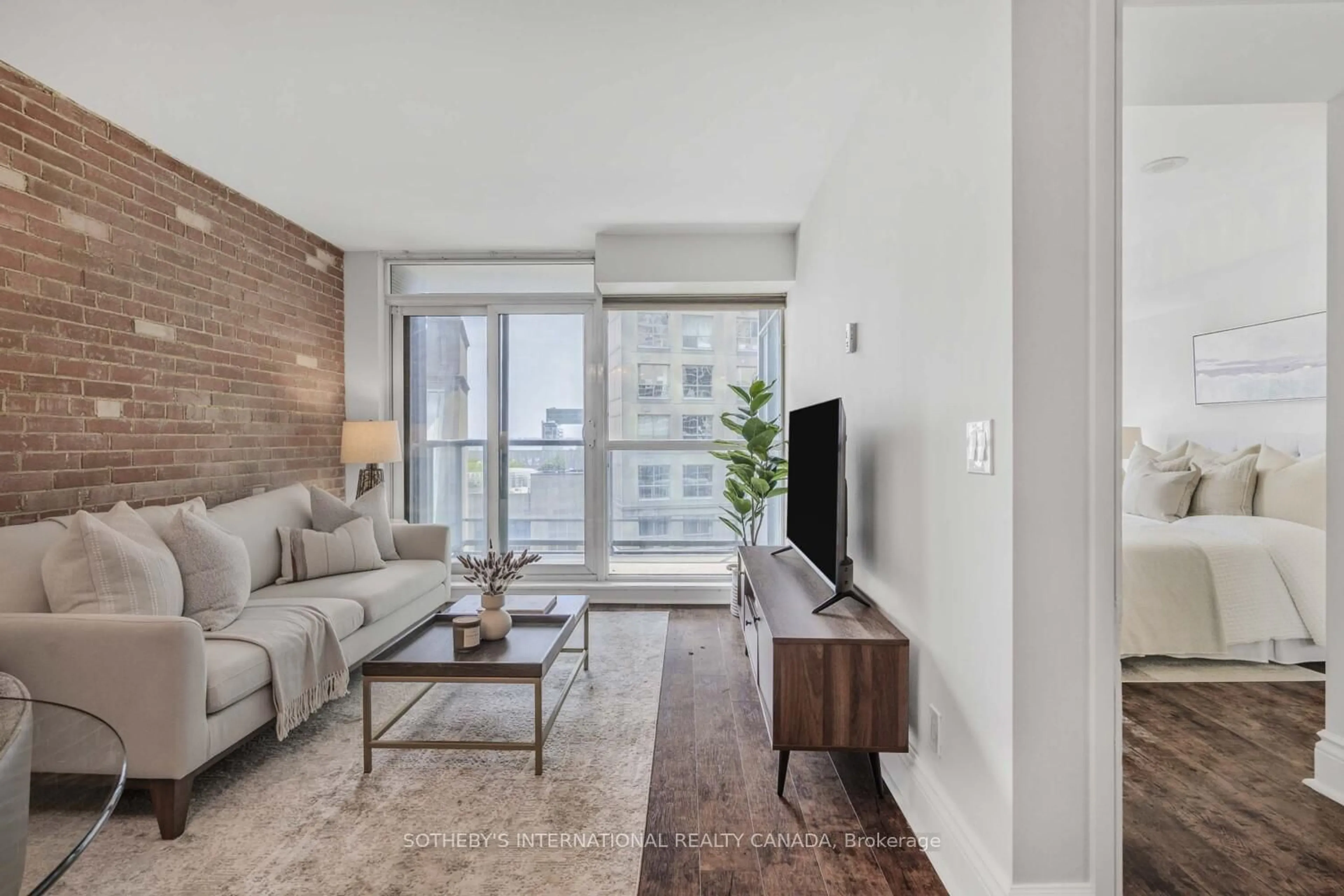 Living room with furniture, unknown for 1 Scott St #803, Toronto Ontario M5E 1A1