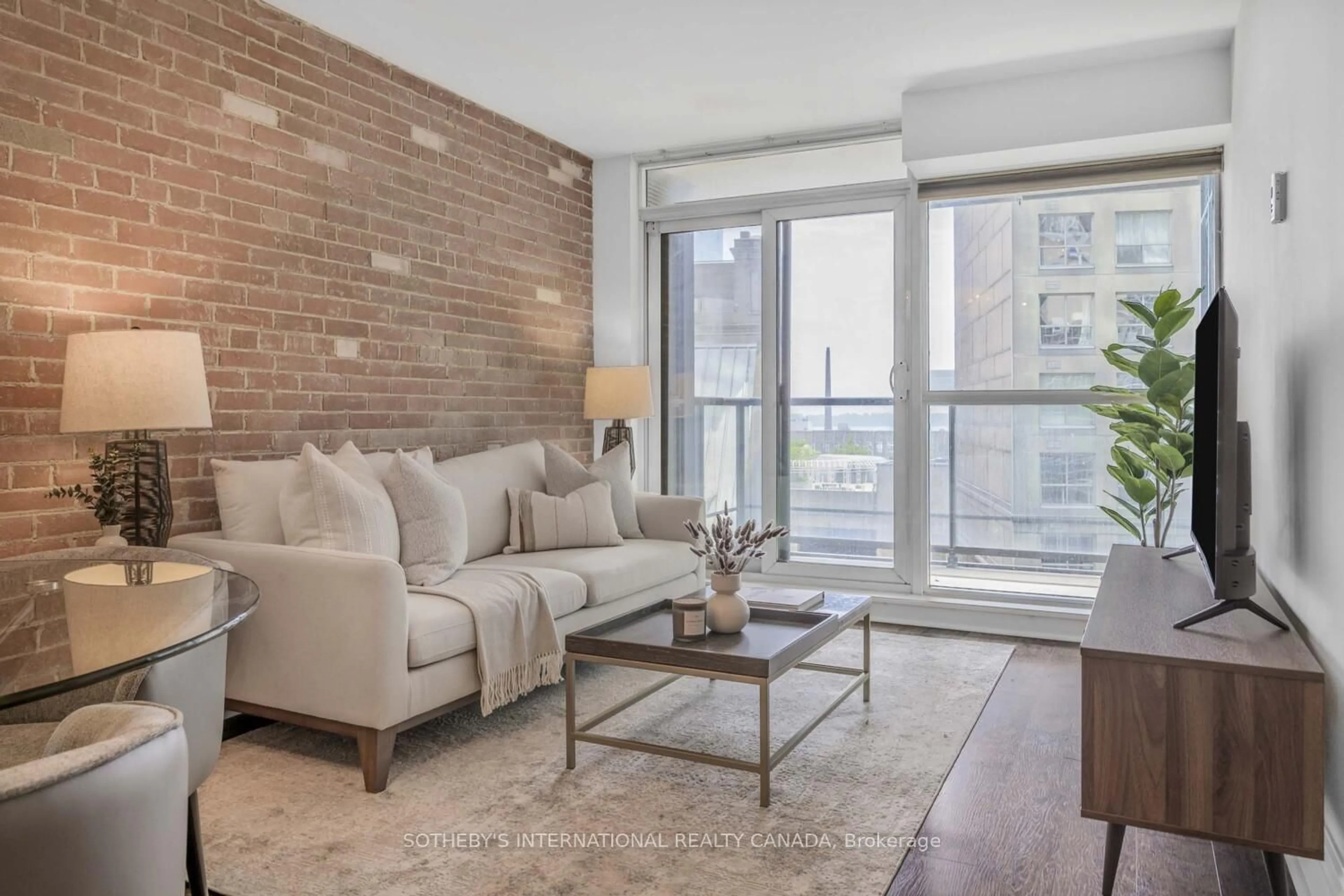 Living room with furniture, unknown for 1 Scott St #803, Toronto Ontario M5E 1A1