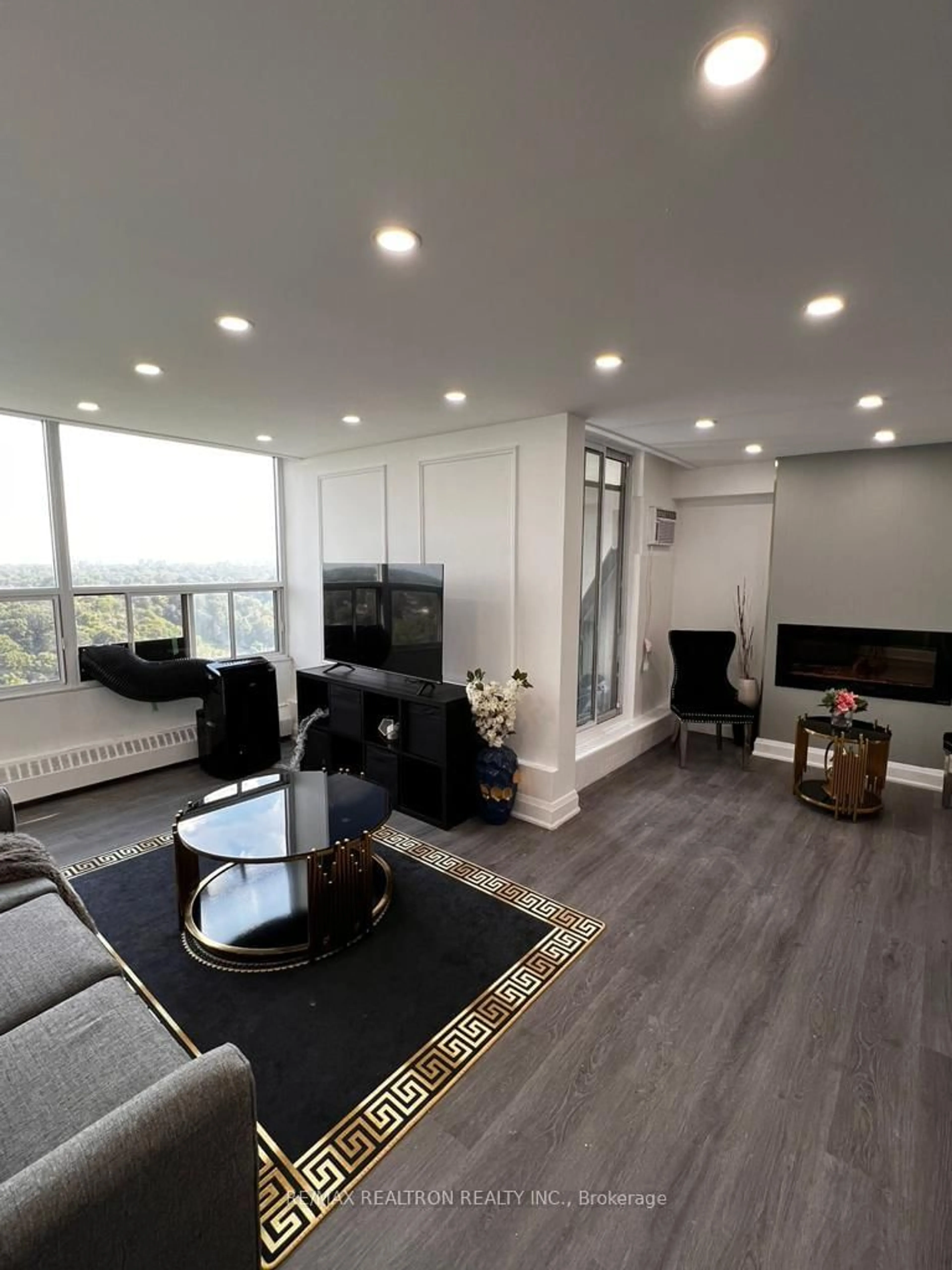 Living room with furniture, wood/laminate floor for 60 Pavane Linkway Way #1804, Toronto Ontario M3C 2Y6