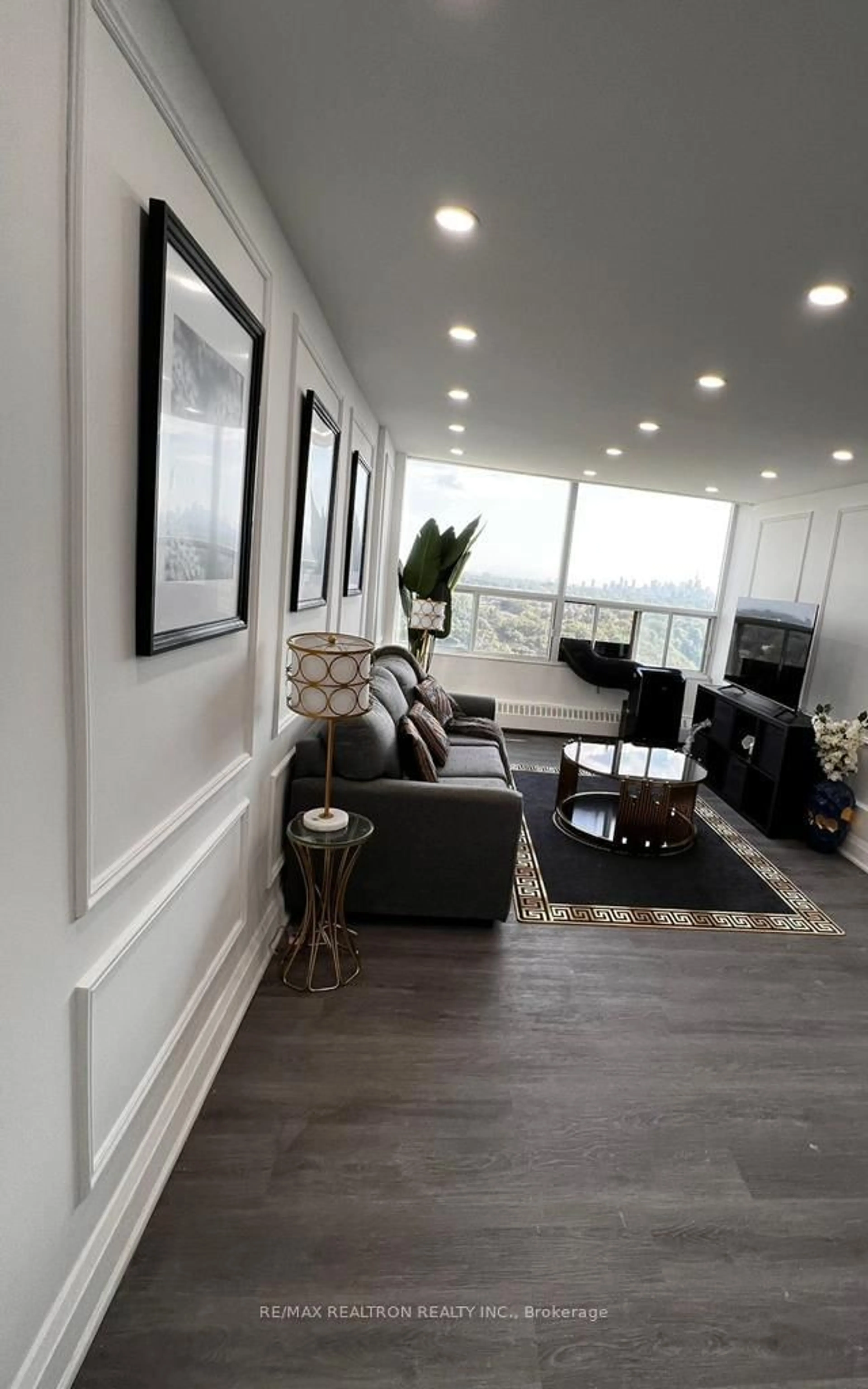 Living room with furniture, wood/laminate floor for 60 Pavane Linkway Way #1804, Toronto Ontario M3C 2Y6