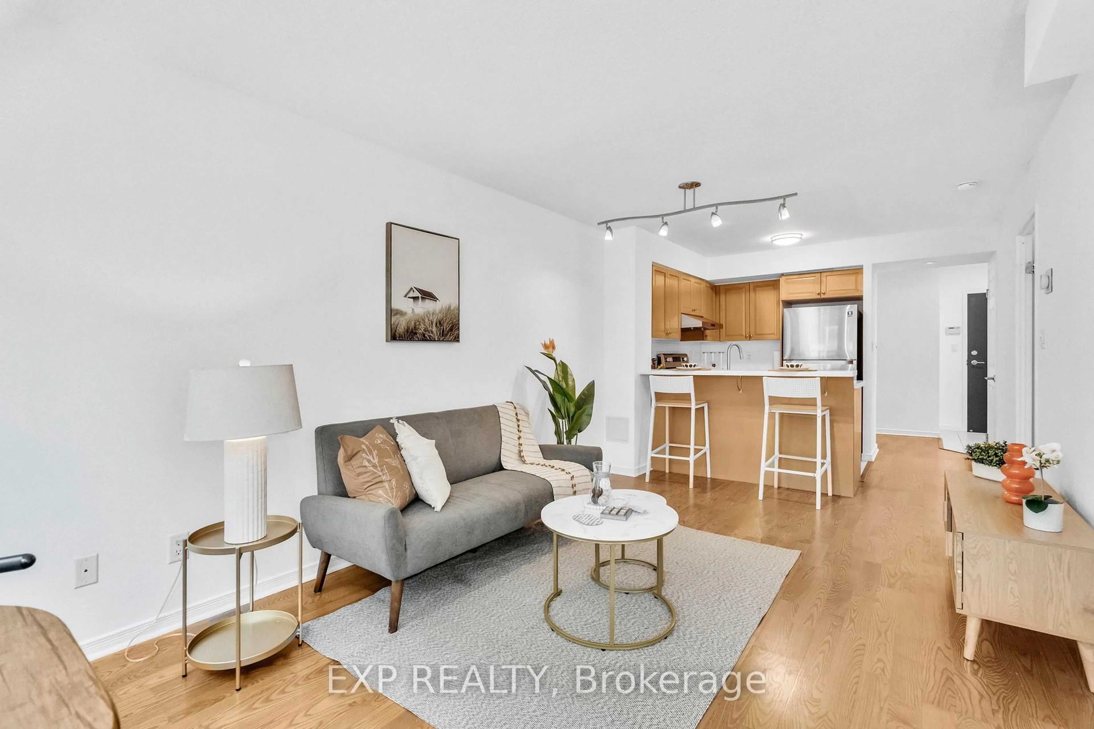Living room with furniture, wood/laminate floor for 230 King St #812, Toronto Ontario M5A 1K5