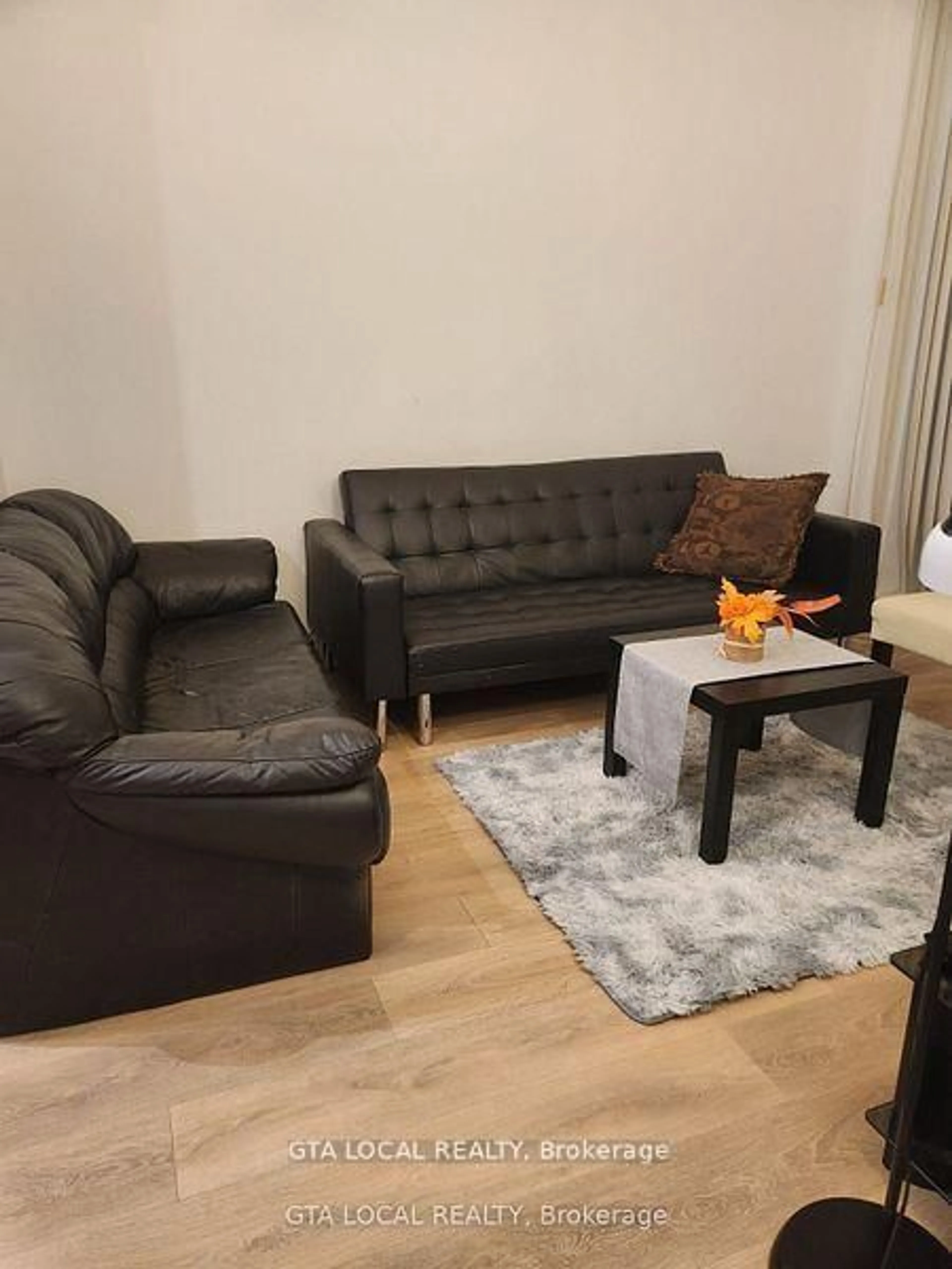 Living room with furniture, wood/laminate floor for 34 Tubman Ave #406, Toronto Ontario M5A 0R2