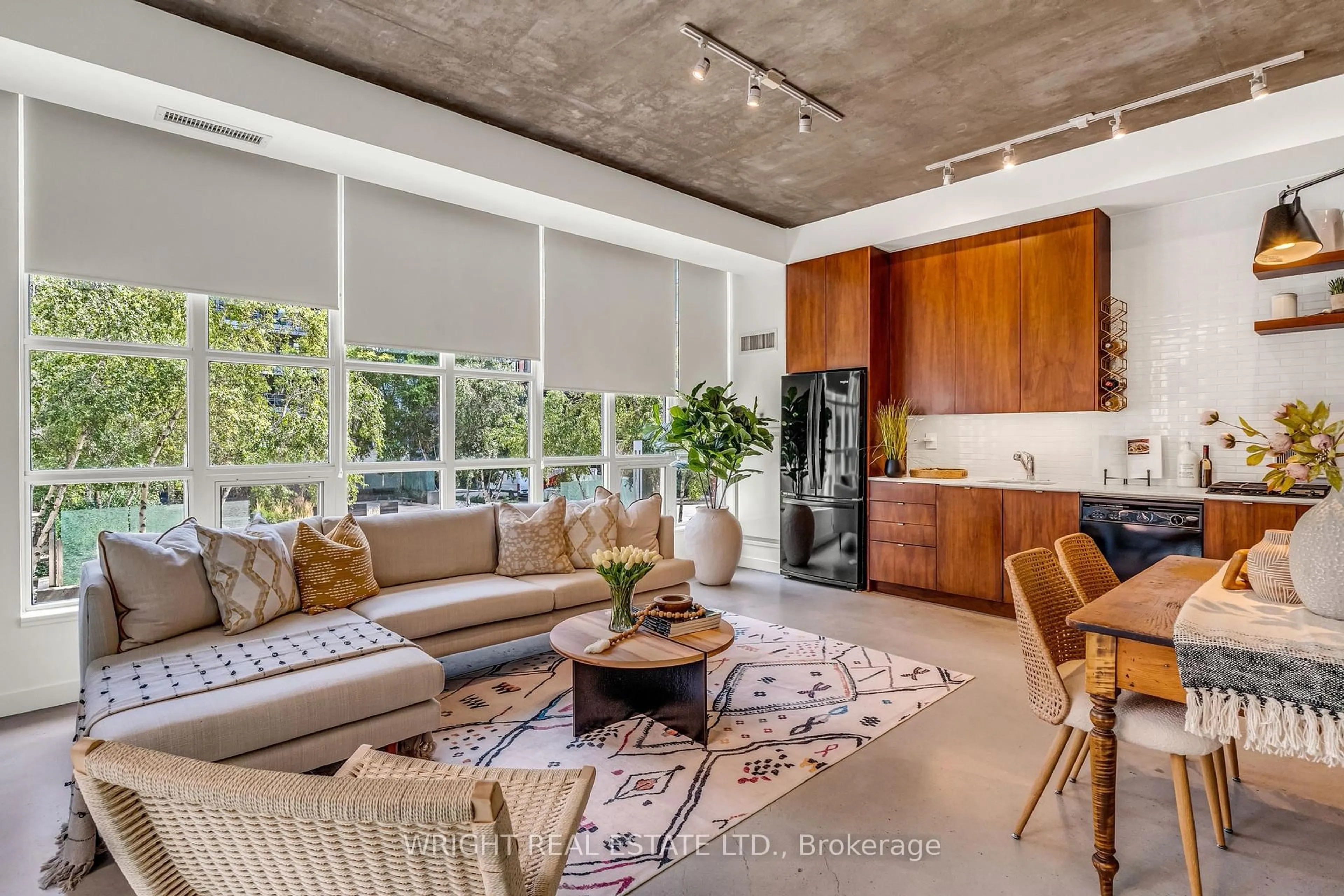 Living room with furniture, cement floor for 19 Brant St #209, Toronto Ontario M5V 2L2