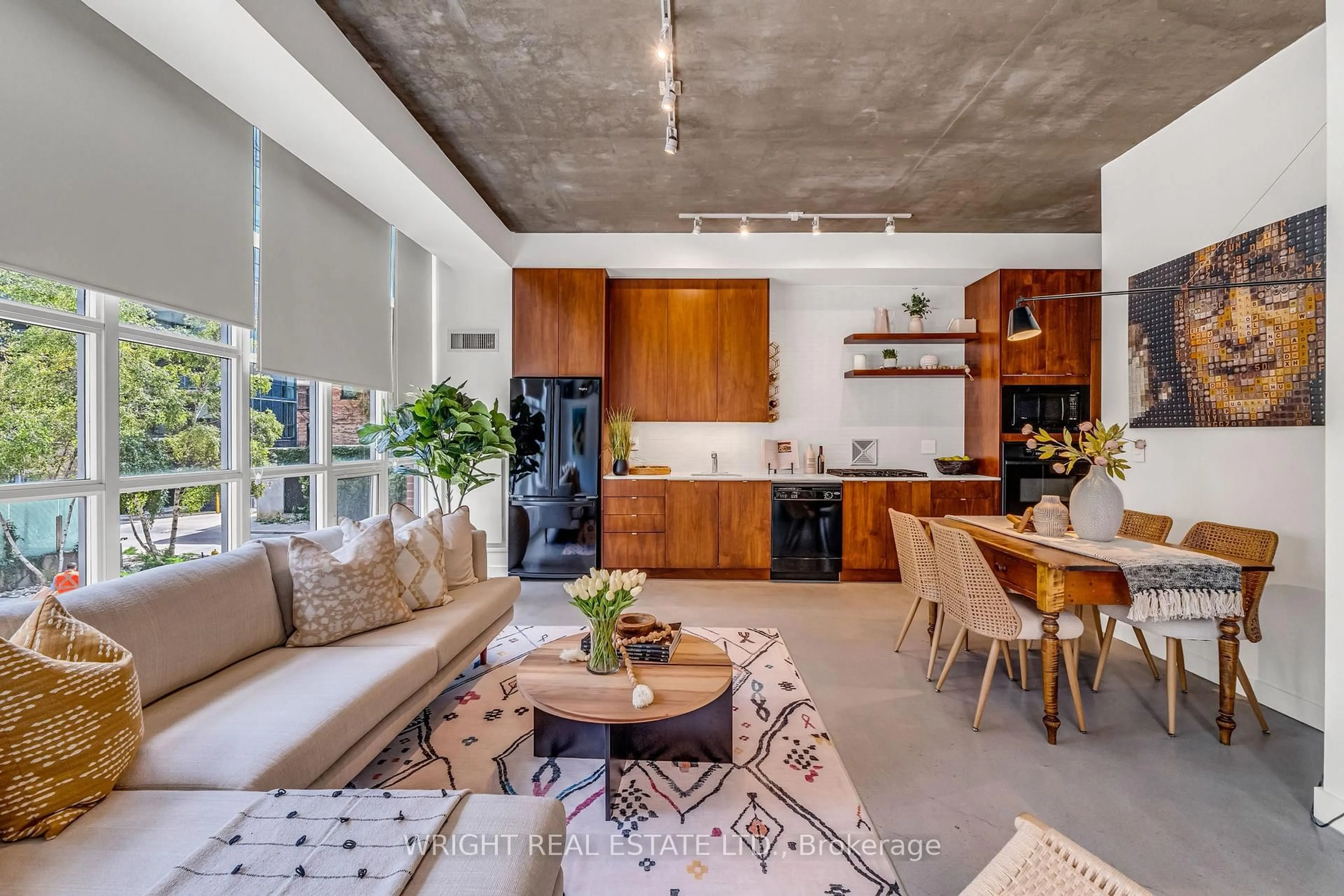 Open concept kitchen, cement floor for 19 Brant St #209, Toronto Ontario M5V 2L2