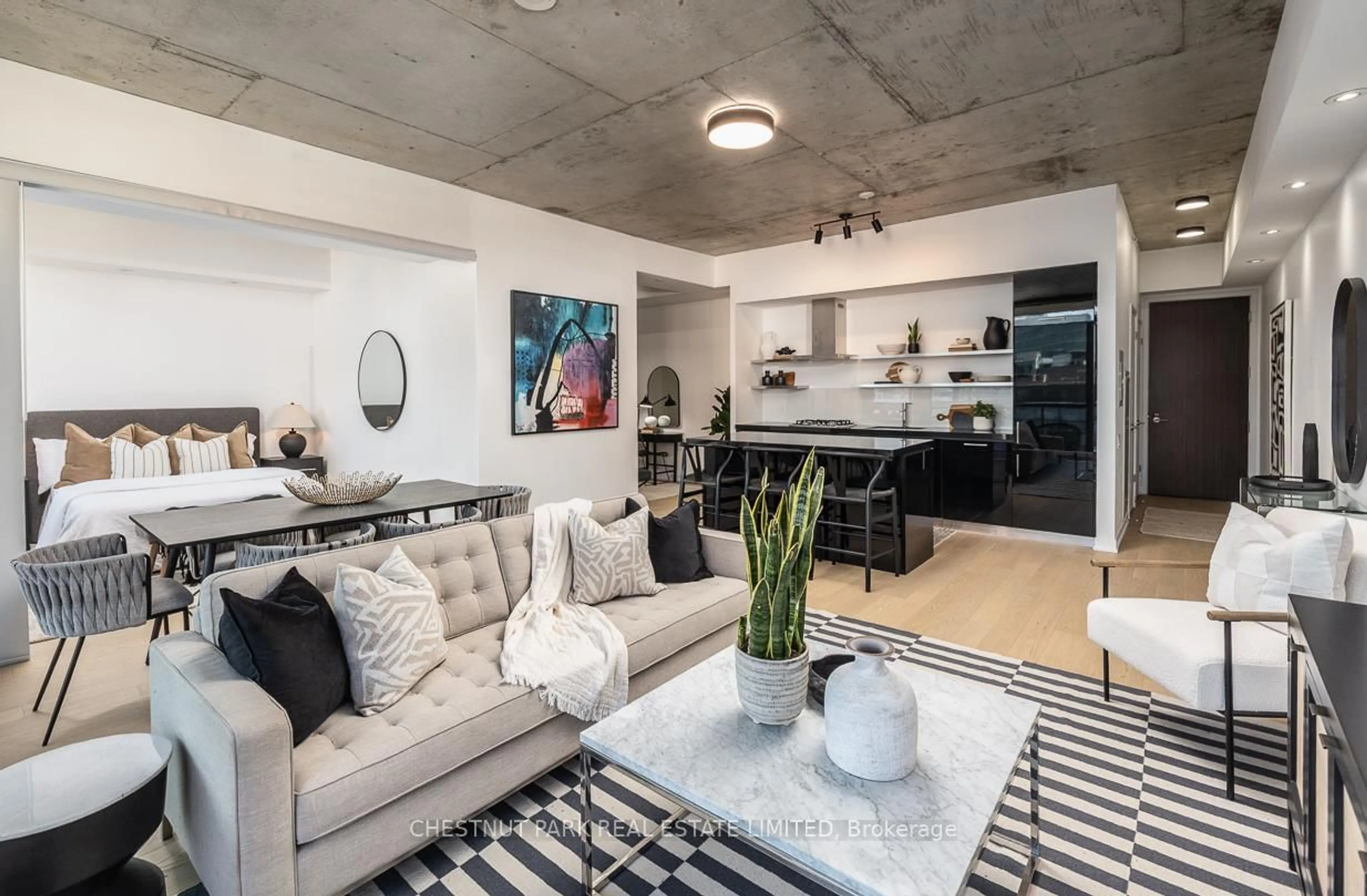 Living room with furniture, cement floor for 560 King St #1014, Toronto Ontario M5V 0L6