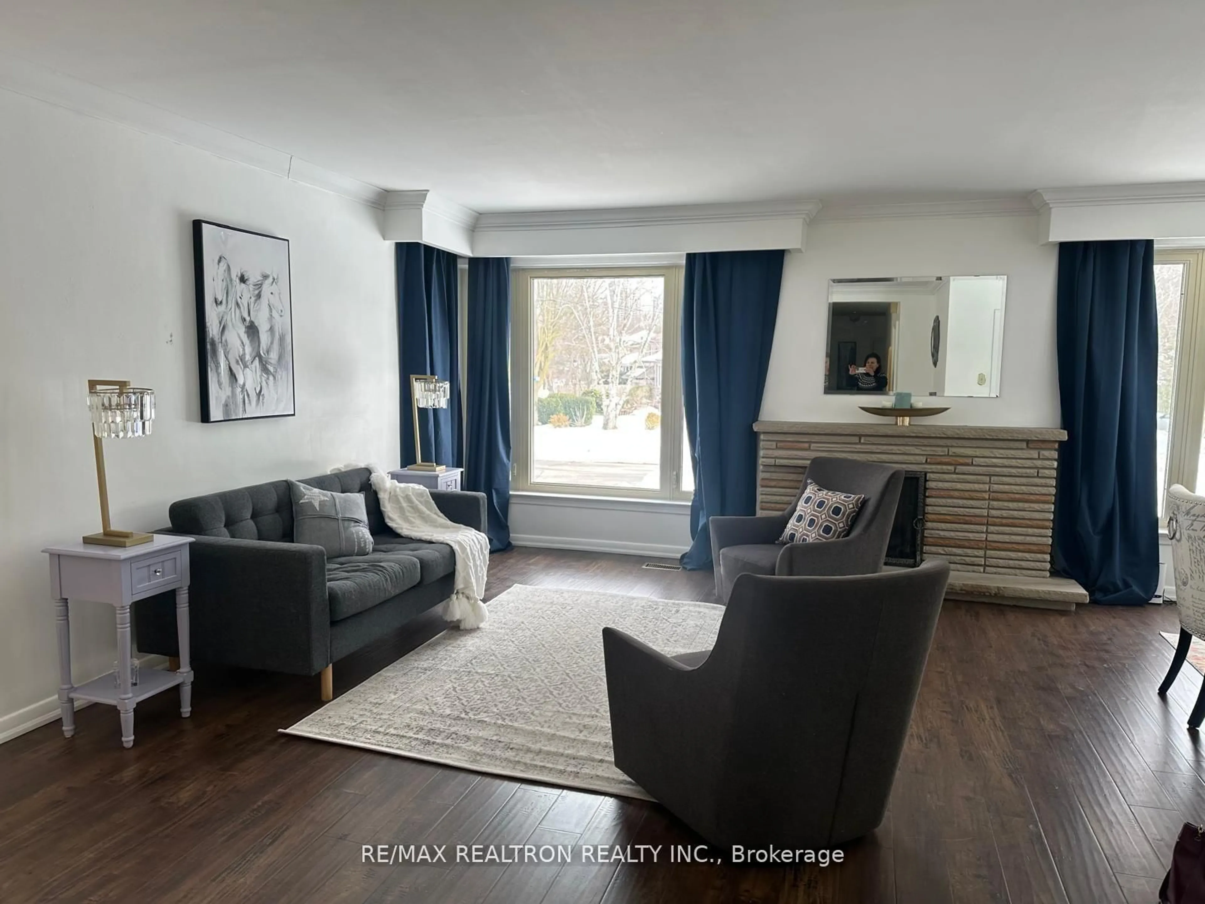 Living room with furniture, wood/laminate floor for 66 Claywood Rd, Toronto Ontario M2N 2R2