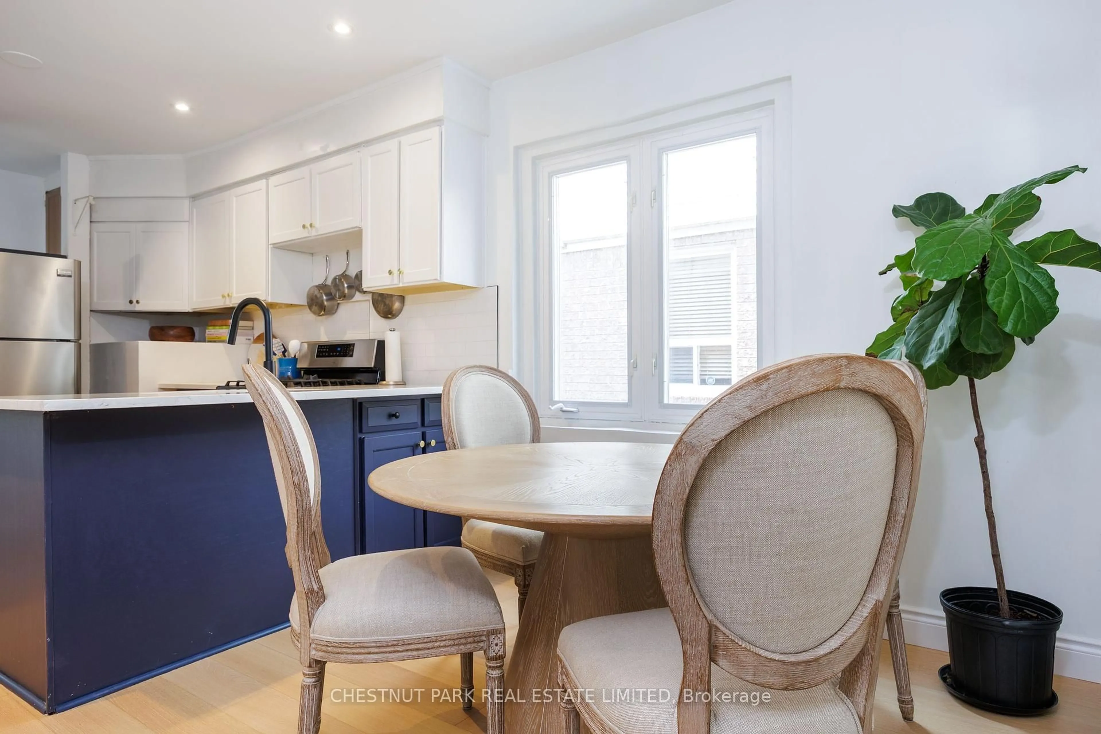 Open concept kitchen, wood/laminate floor for 154 Cedric Ave, Toronto Ontario M4T 1X3