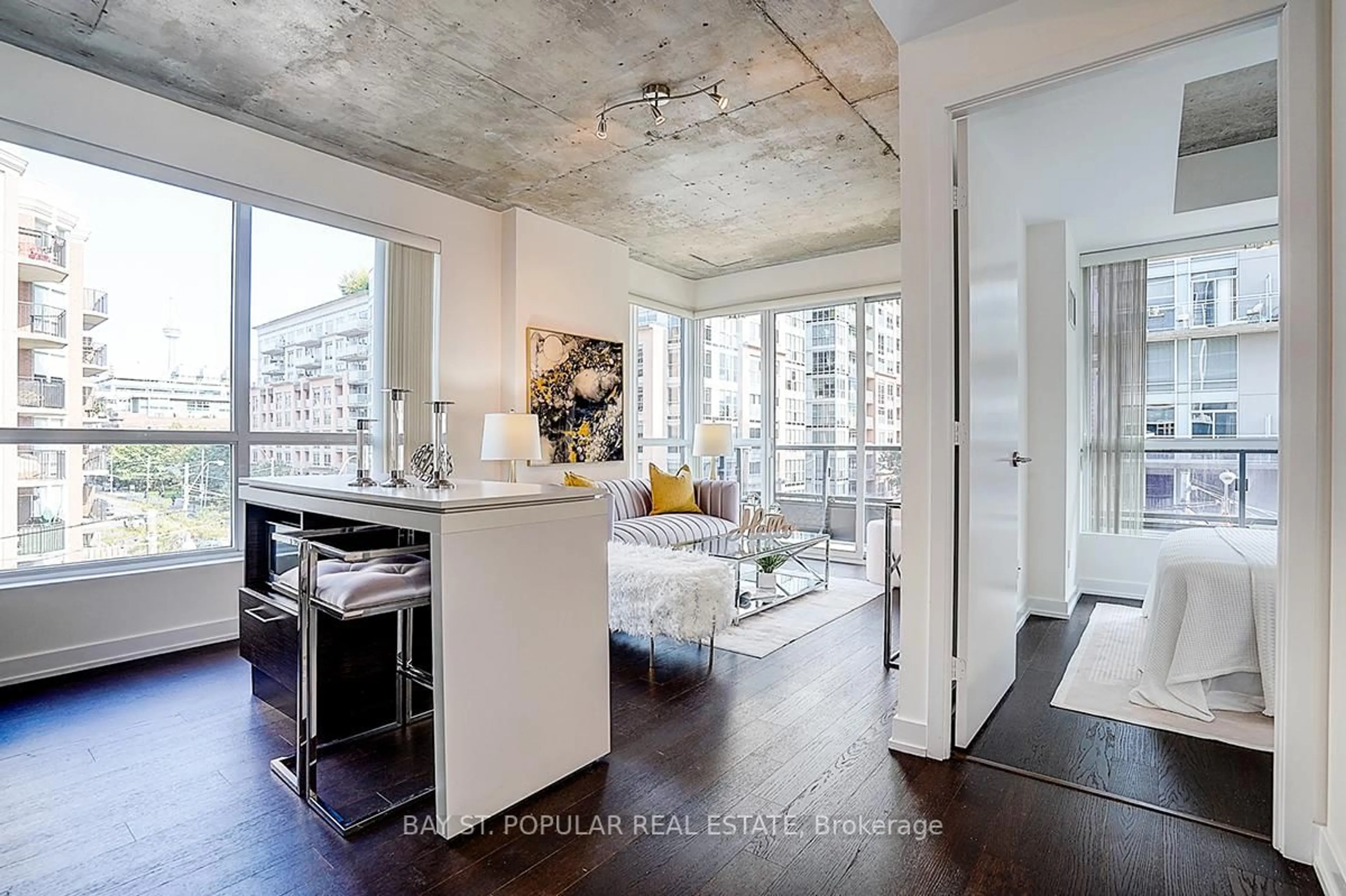 Open concept kitchen, cement floor for 1030 King St #321, Toronto Ontario M6K 0B4