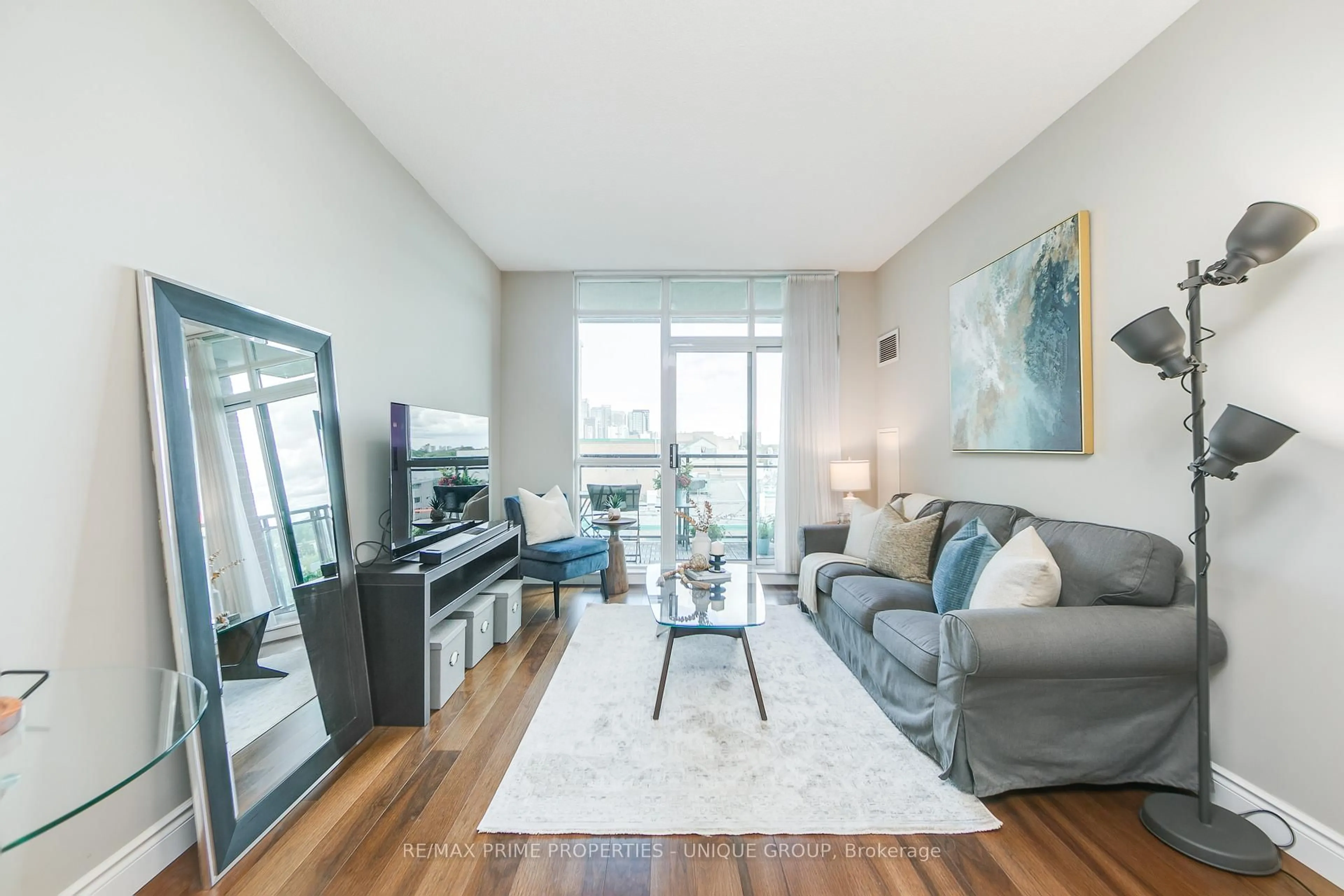 Living room with furniture, wood/laminate floor for 319 Merton St #904, Toronto Ontario M4S 1A5