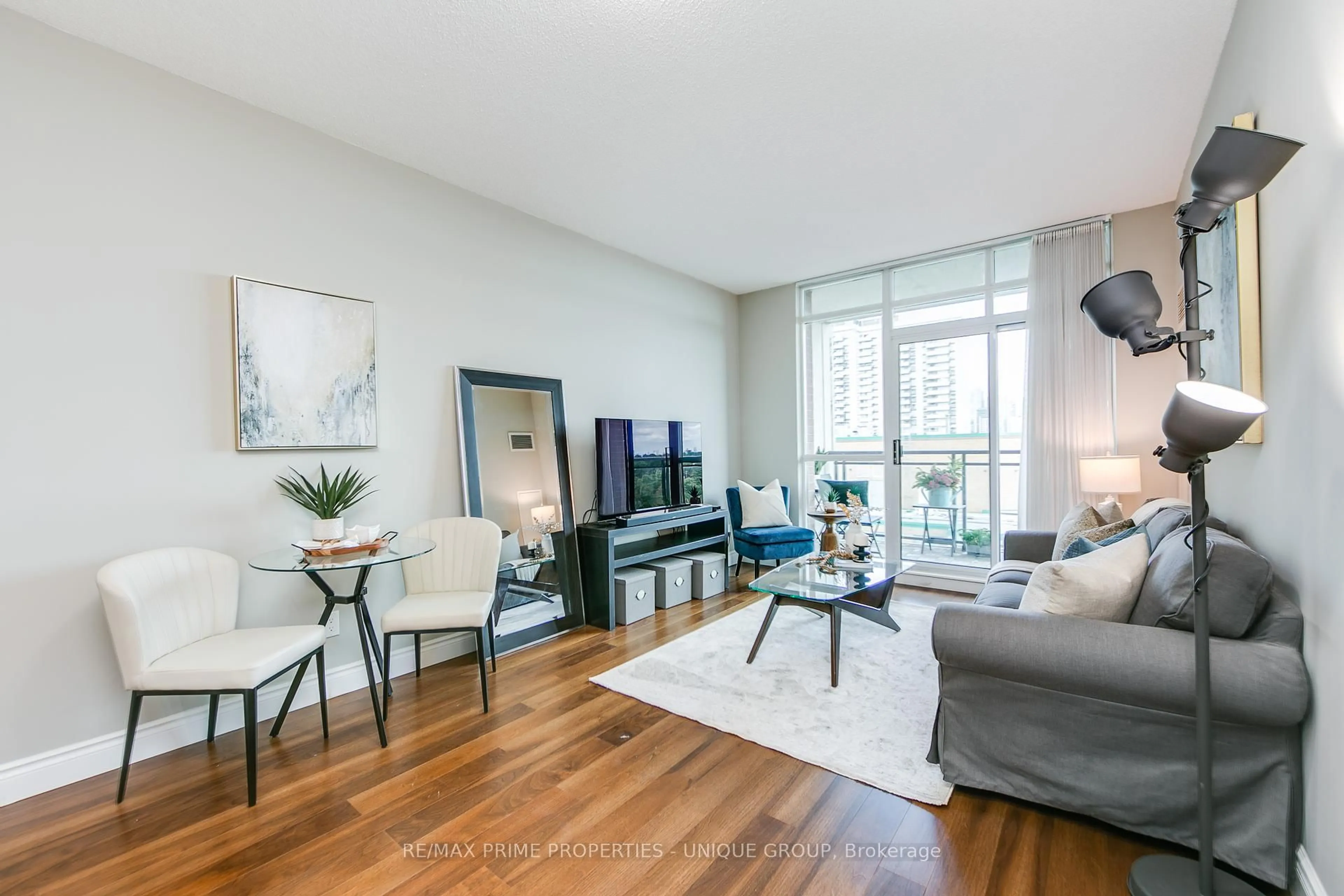 Living room with furniture, wood/laminate floor for 319 Merton St #904, Toronto Ontario M4S 1A5