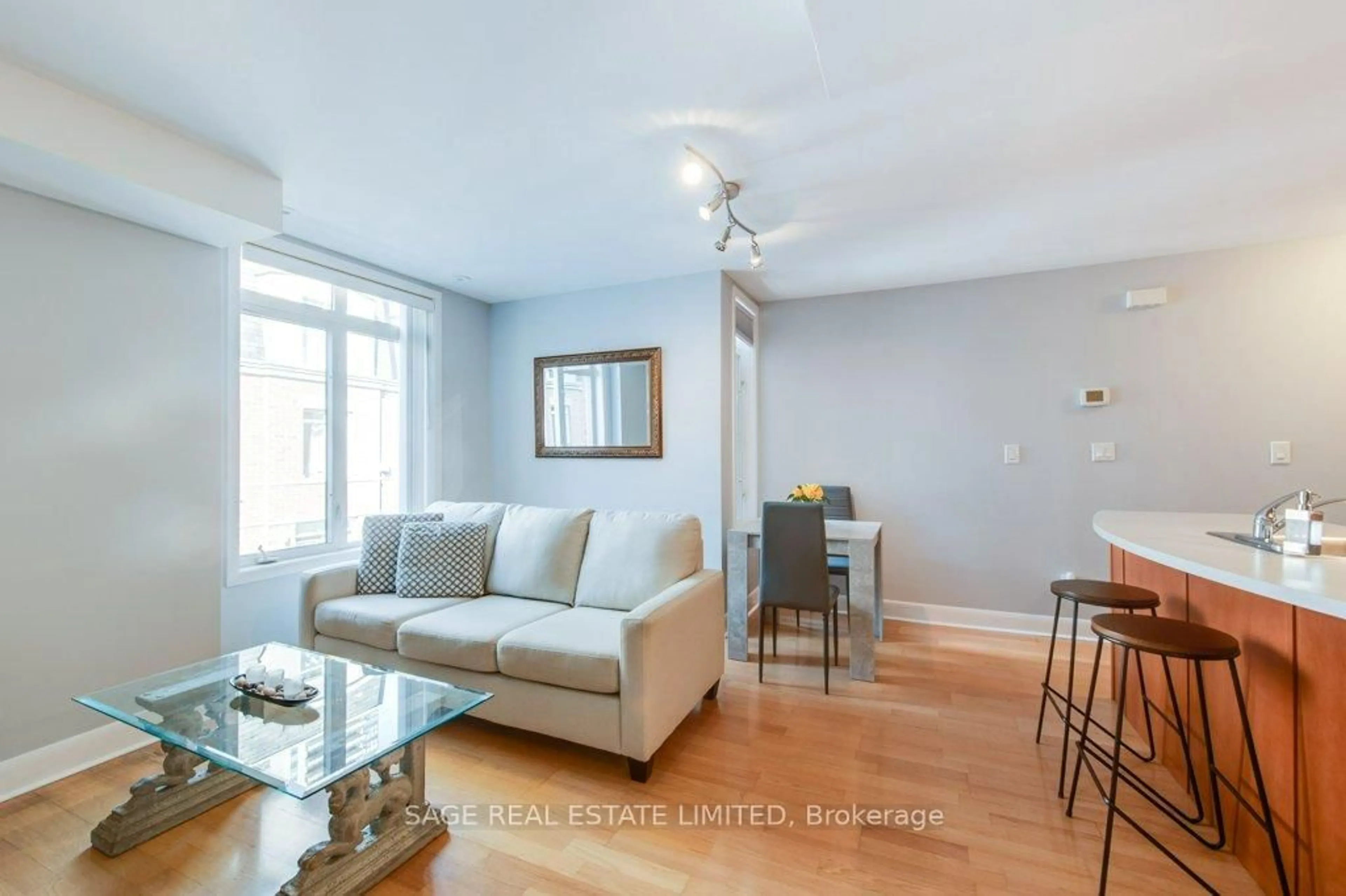 Living room with furniture, wood/laminate floor for 415 Jarvis St #338, Toronto Ontario M4Y 3C1