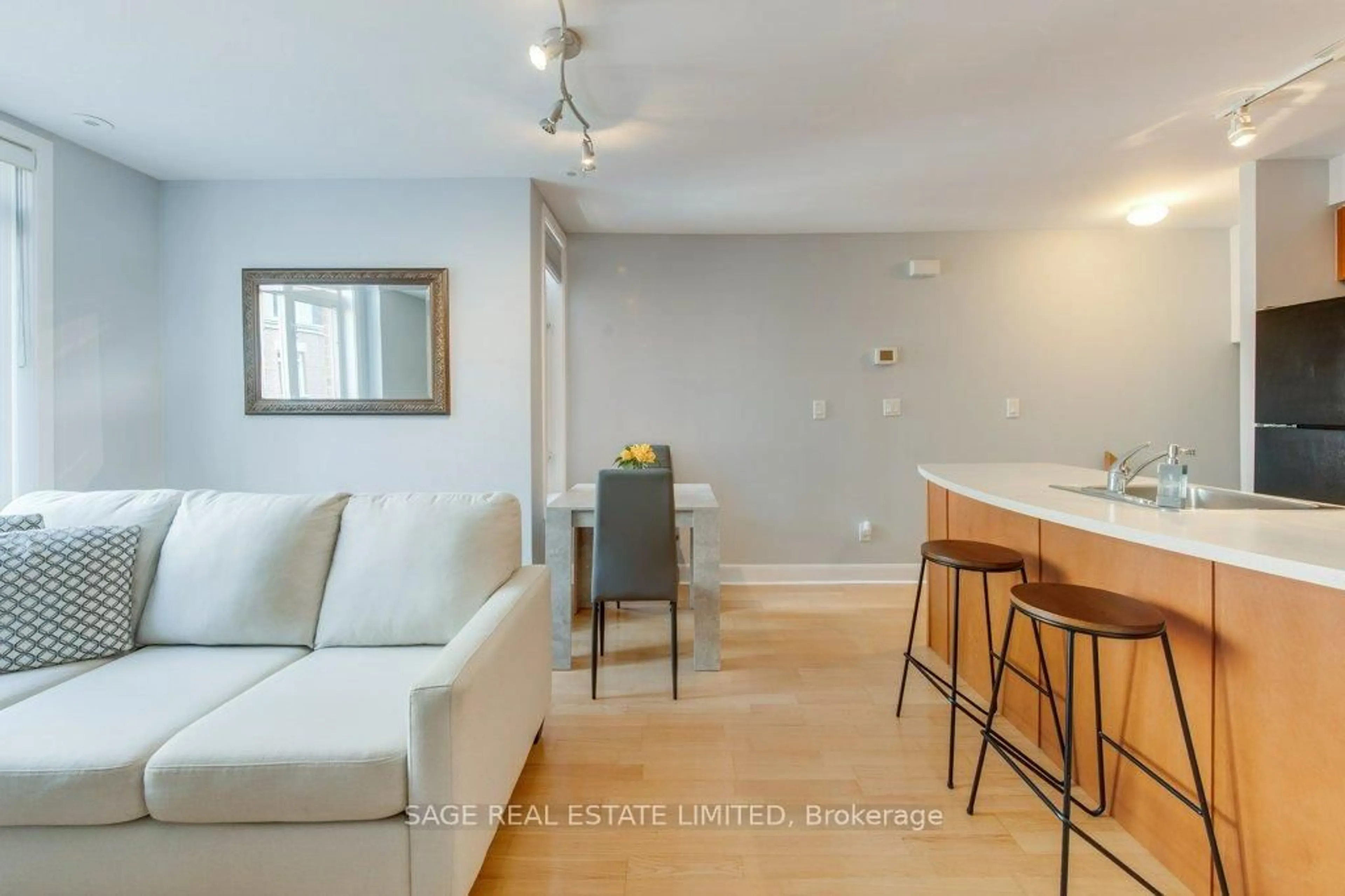 Living room with furniture, wood/laminate floor for 415 Jarvis St #338, Toronto Ontario M4Y 3C1