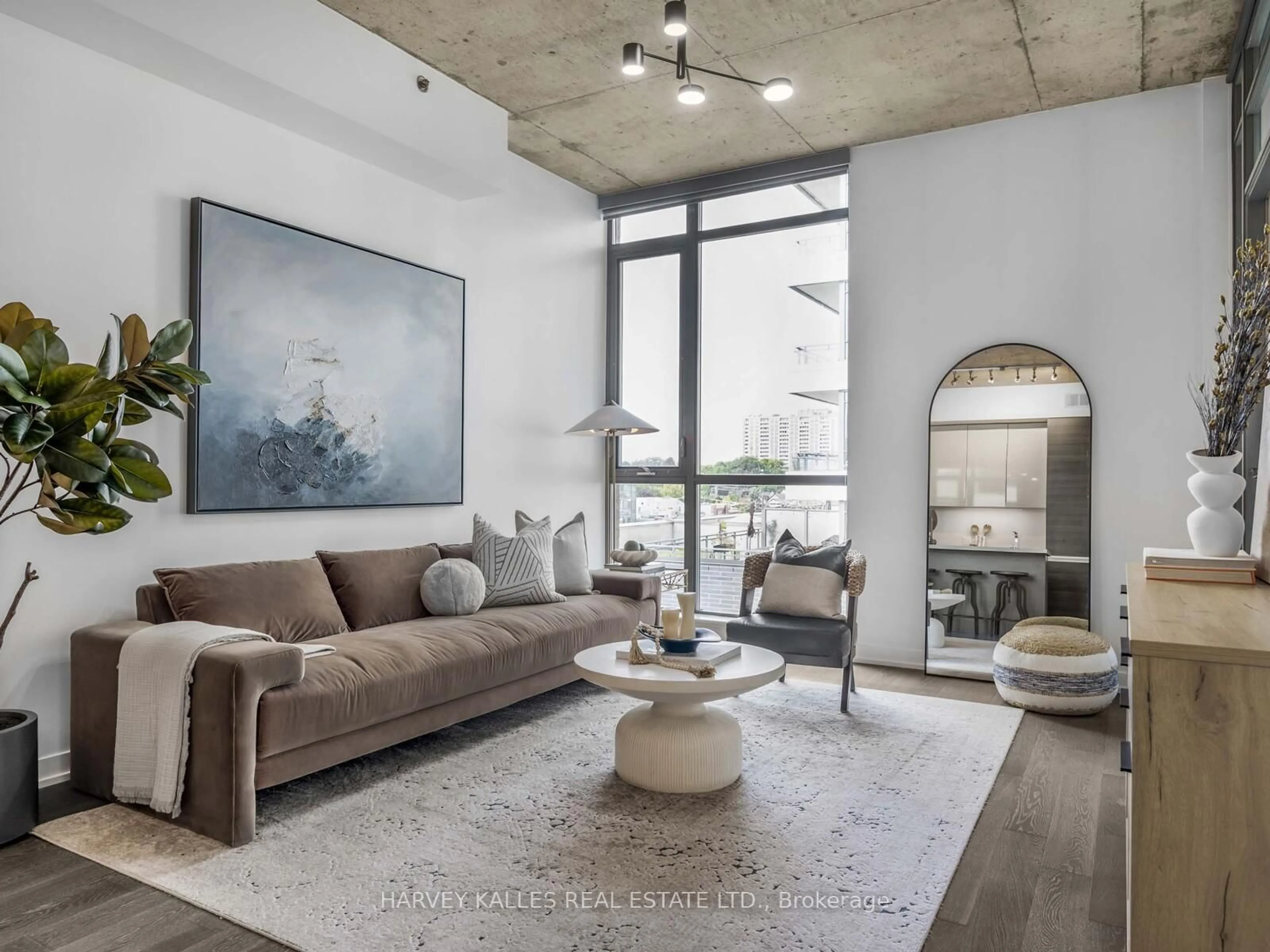 Living room with furniture, cement floor for 8 Gladstone Ave #615, Toronto Ontario M6J 3K6