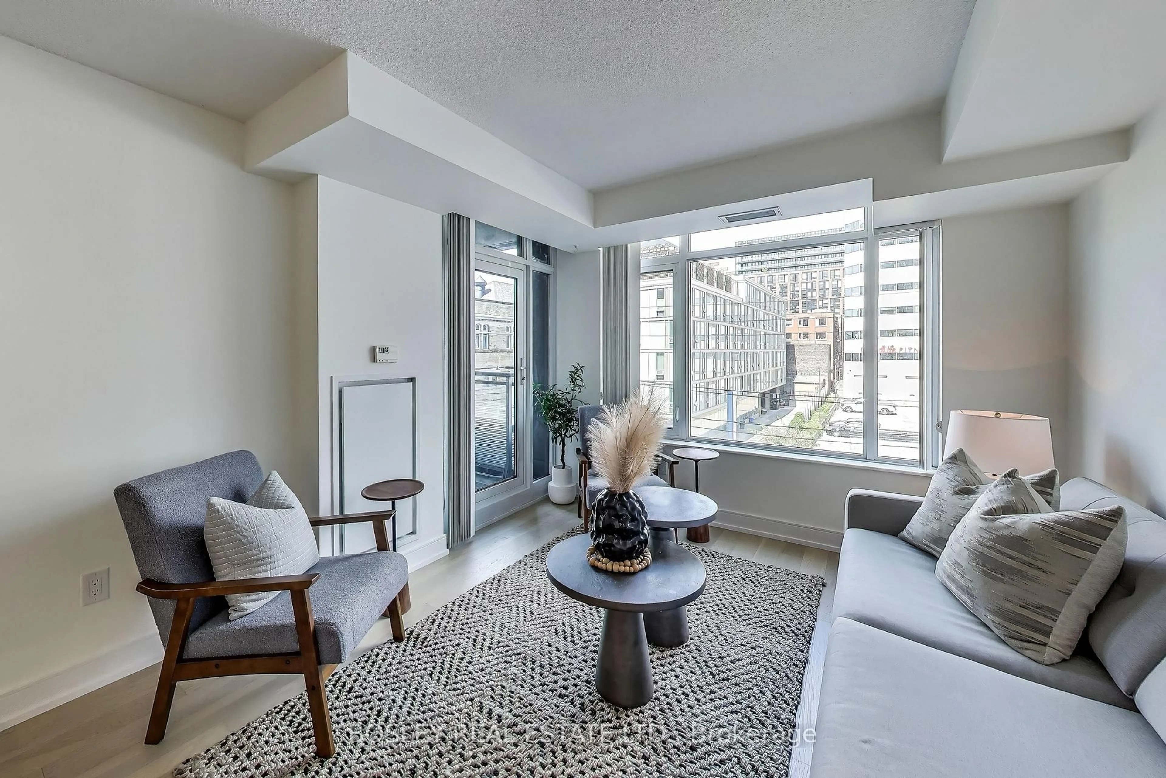 Living room with furniture, unknown for 525 Adelaide St #311, Toronto Ontario M5V 0N7