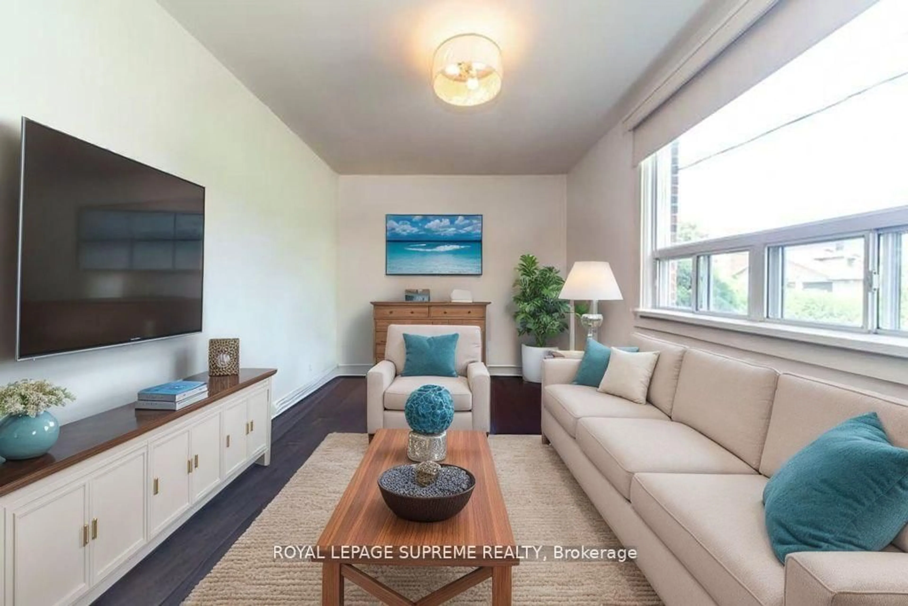 Living room with furniture, wood/laminate floor for 109 Regina Ave, Toronto Ontario M6A 1R5